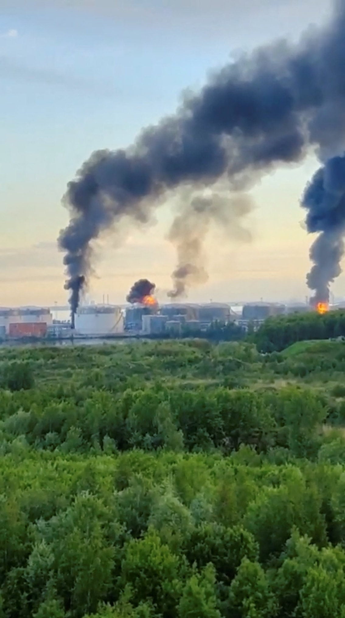 Smoke billows following hits by Ukrainian drones at an oil terminal in St Petersburg, Russia, on Wednesday. Photo: Social media via Reuters