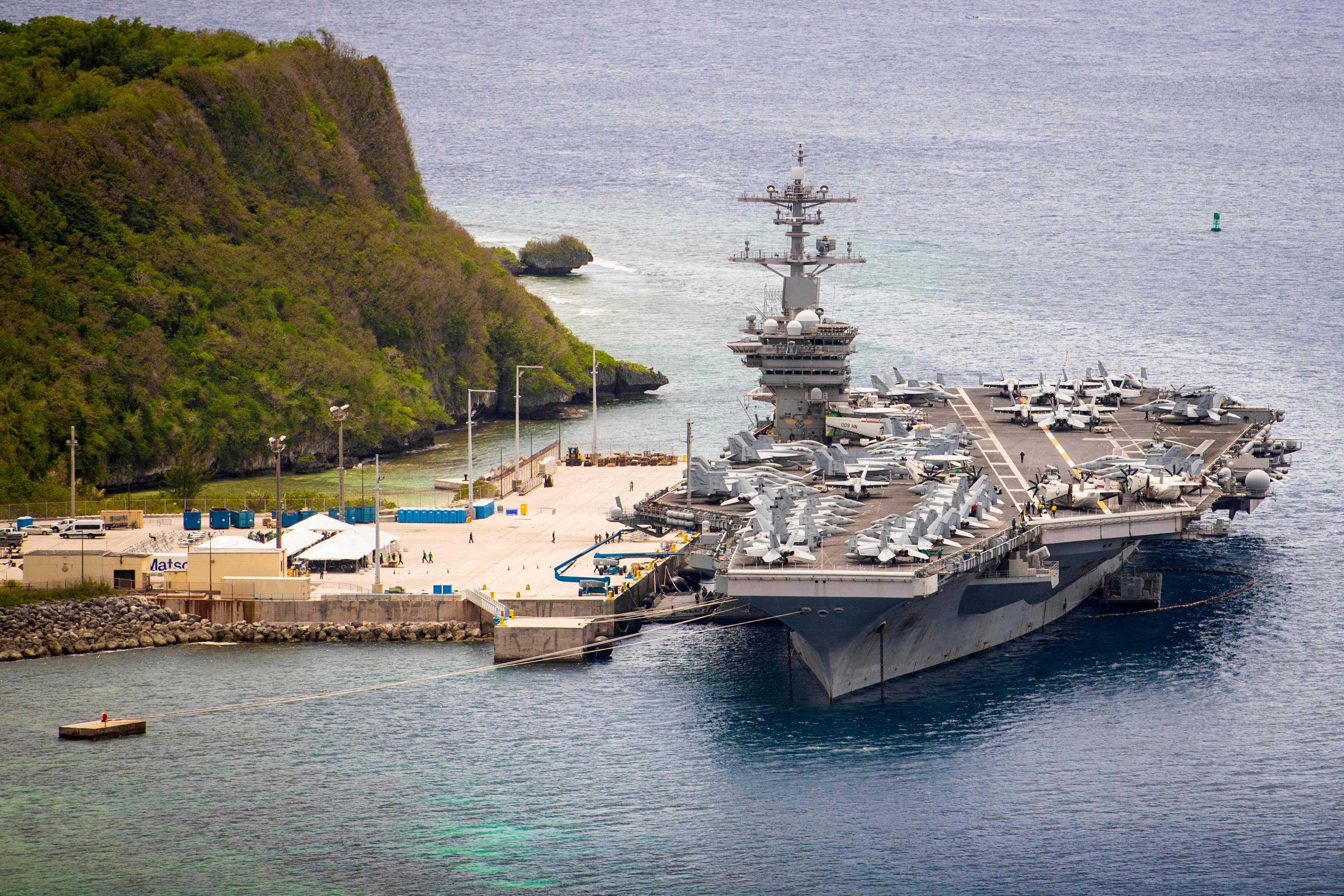 Aircraft carrier USS Theodore Roosevelt (CVN 71) moored pier side at Naval Base Guam in Micronesia. The US military has quietly pulled its most precious military assets away from Asian coasts, beyond the reach of most conventional missiles. Photo: US Navy/AFP