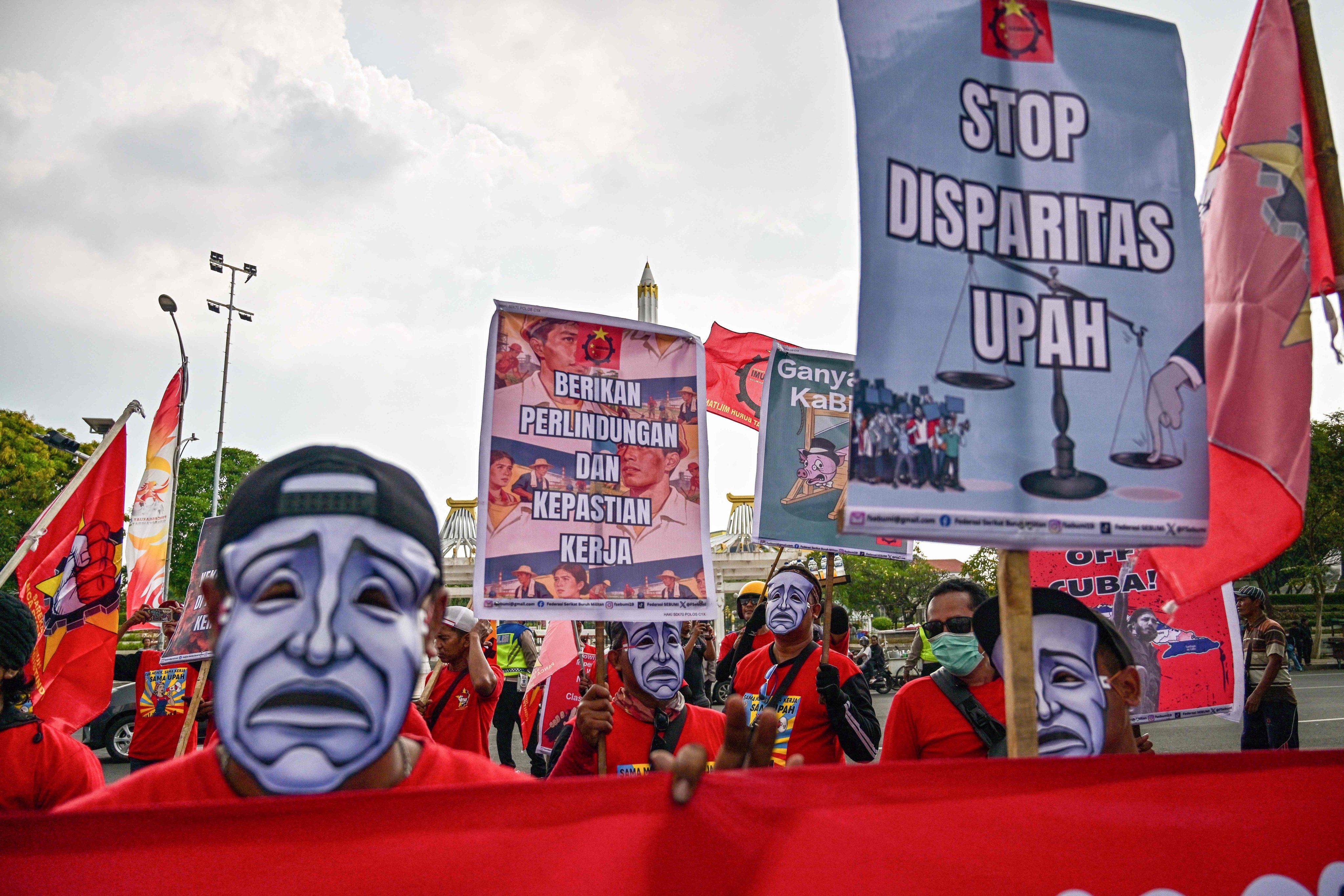 Indonesian workers take part in a protest during a May Day rally marking International Workers’ Day in front of the East Java Governor’s Office in Surabaya on May 1. Photo: AFP