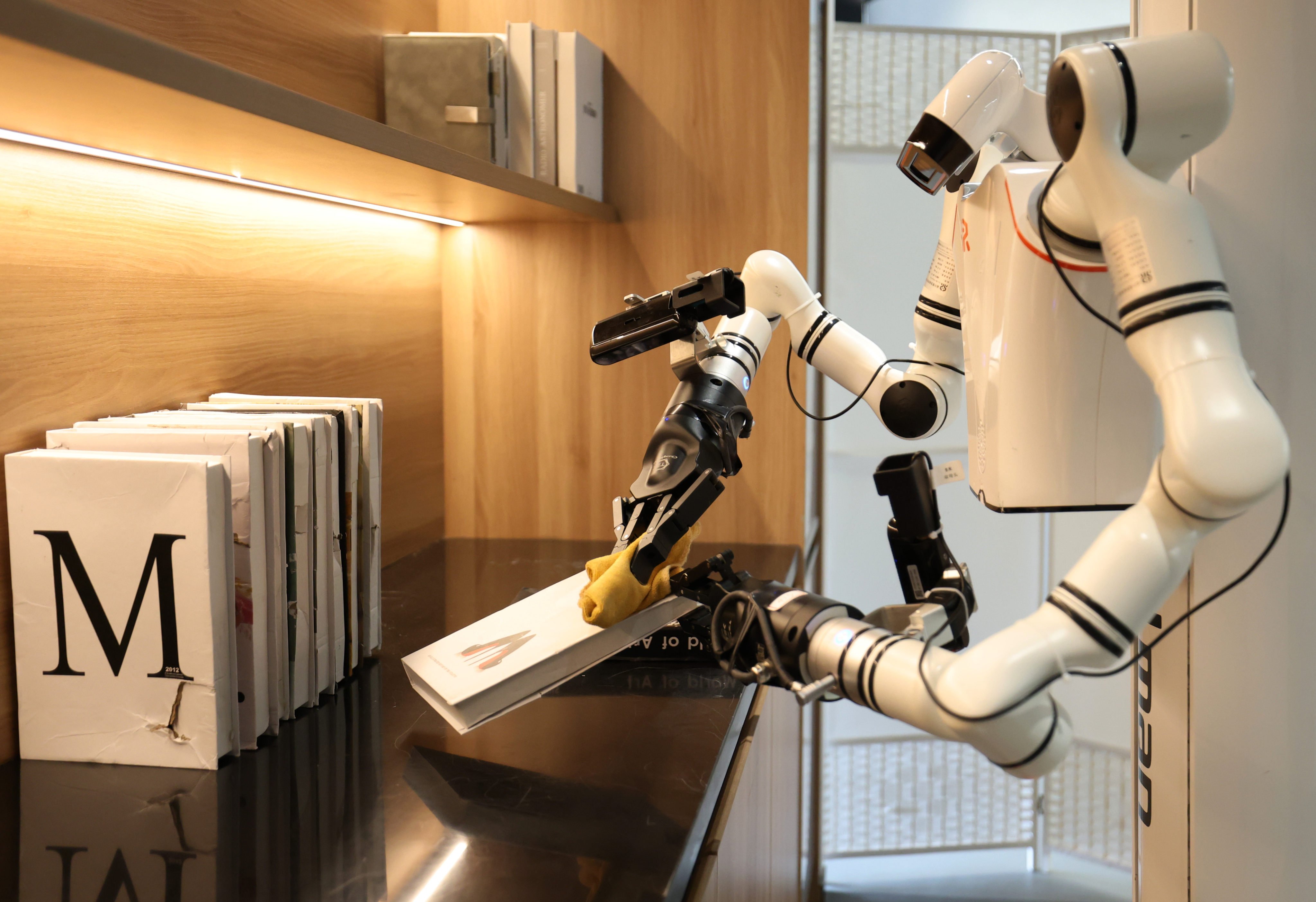 A robot works in a simulated home scenario at the Humanoid Robot Data Training Centre in Shougang Park, in Beijing on March 29, 2026. Photo: Xinhua