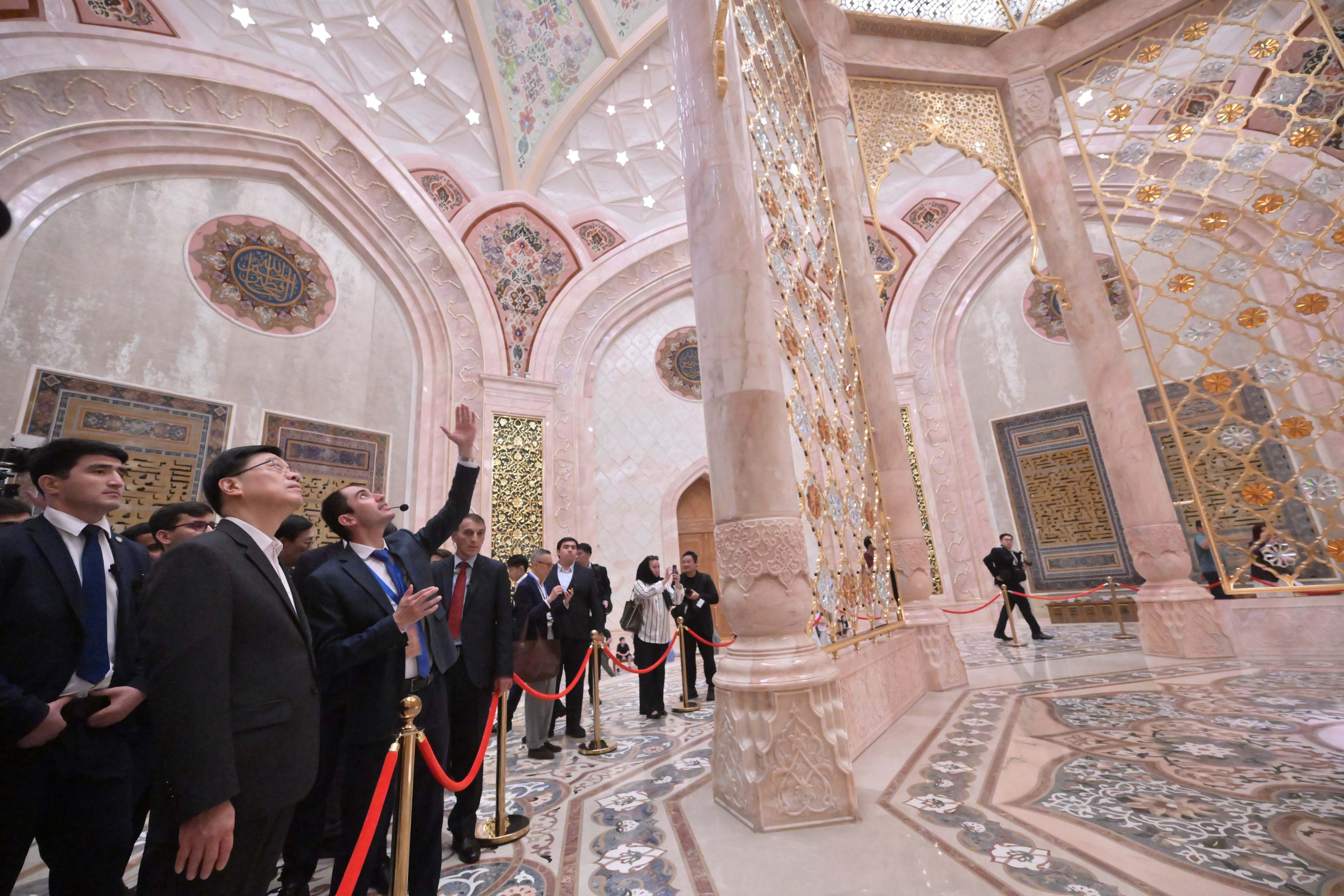Chief Executive John Lee (second left) visits the Islamic Civilization Center in Tashkent to learn about local efforts in cultural preservation, academic research and education promotion. Photo: ISD