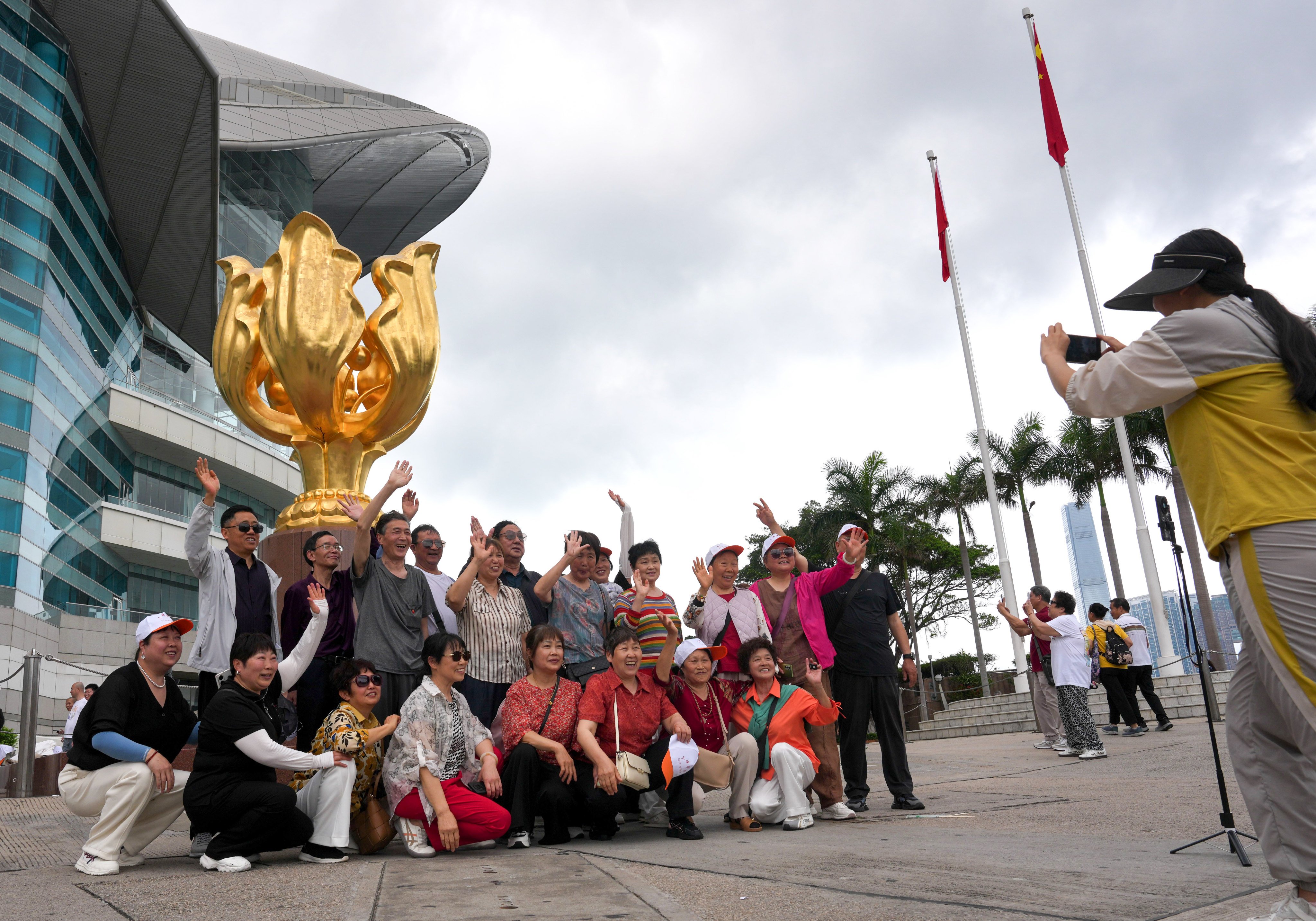 Tourists visiting Golden Bauhinia Square in Wan Chai. Photo: Jelly Tse