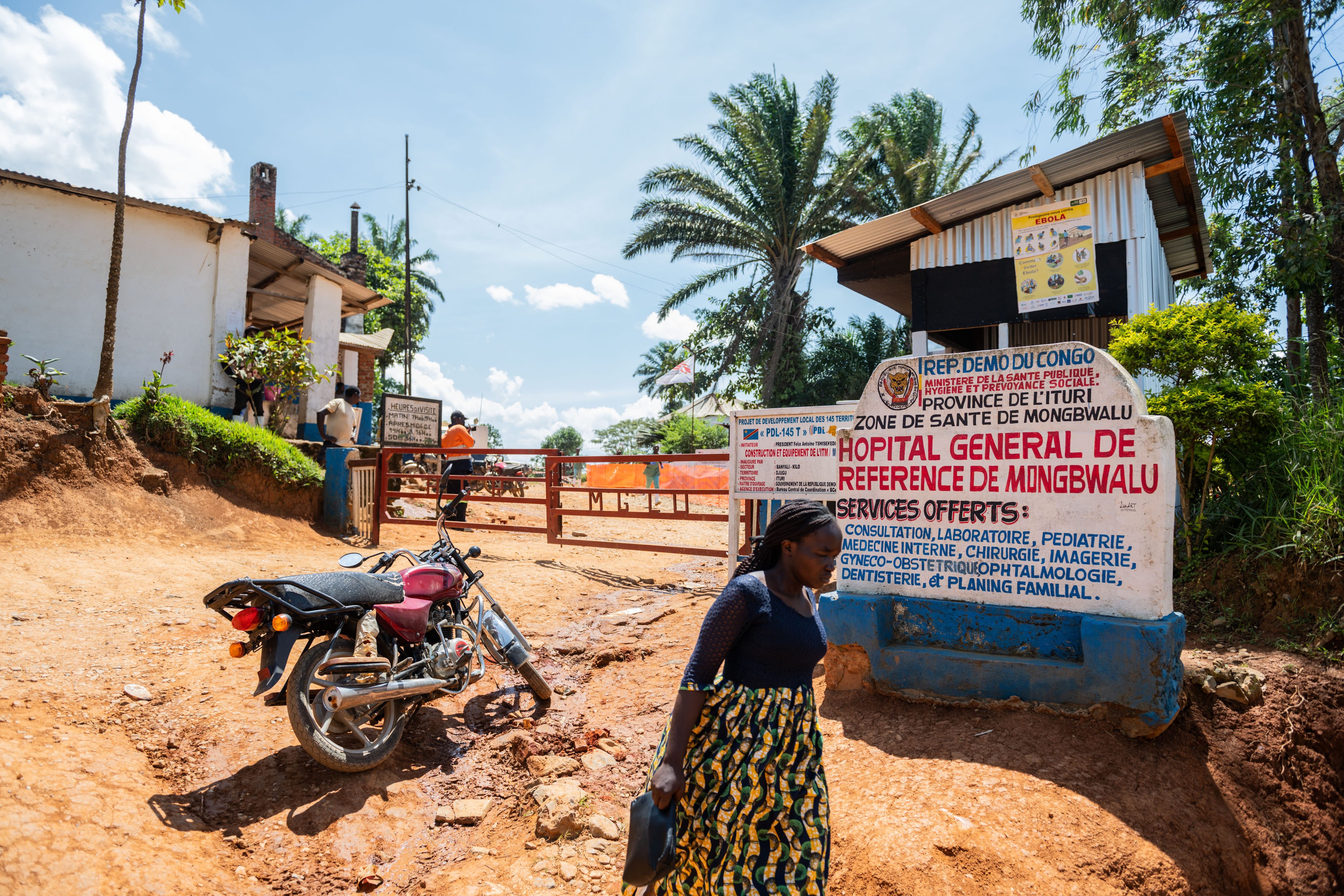 A woman walks past the General Referral Hospital in Mongbwalu, DR Congo, on Friday. Photo: AP