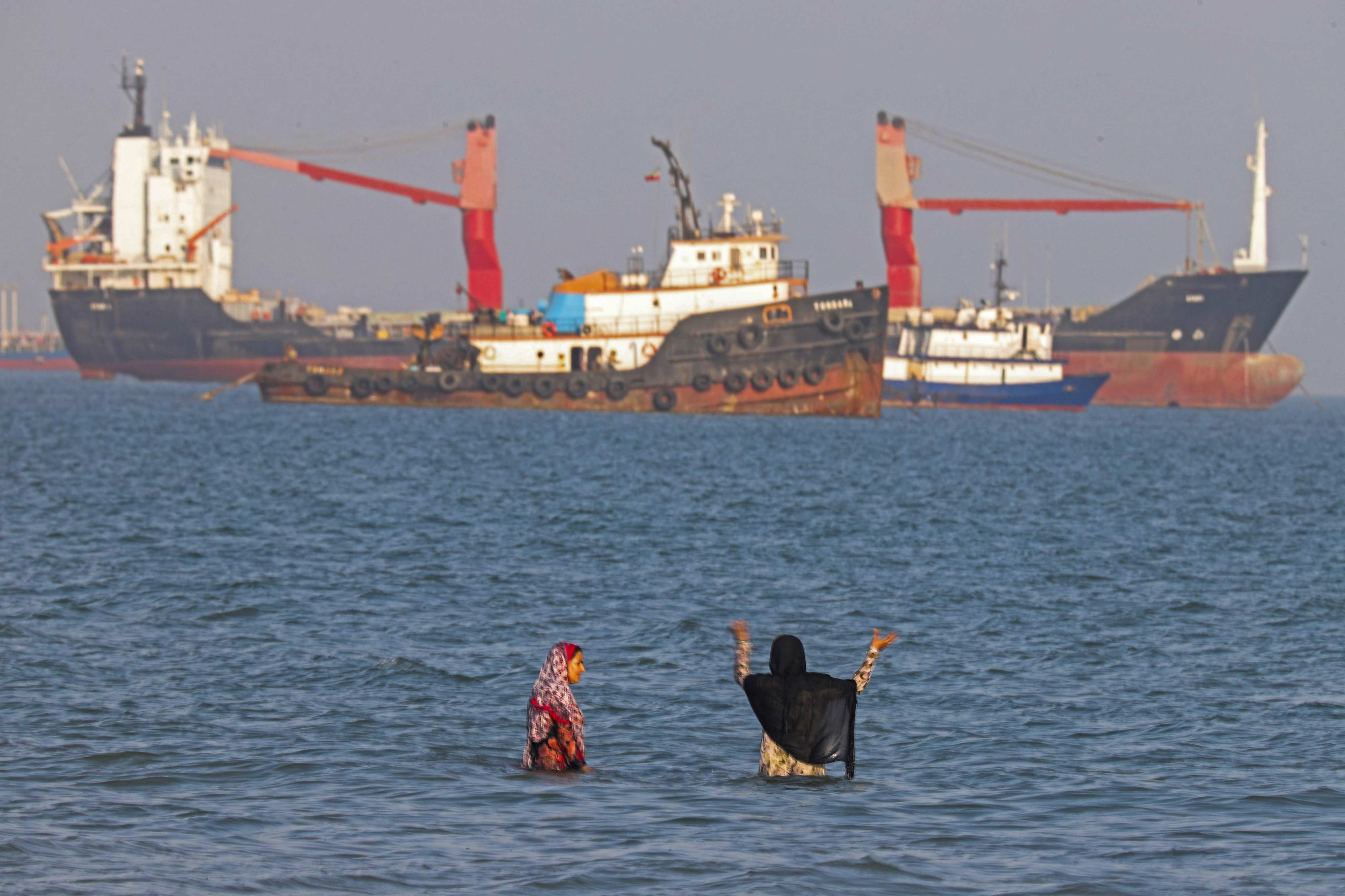 Iranians swim at Suru Beach in Bandar Abbas along the Strait of Hormuz on Monday. Photo: ISNA/AFP