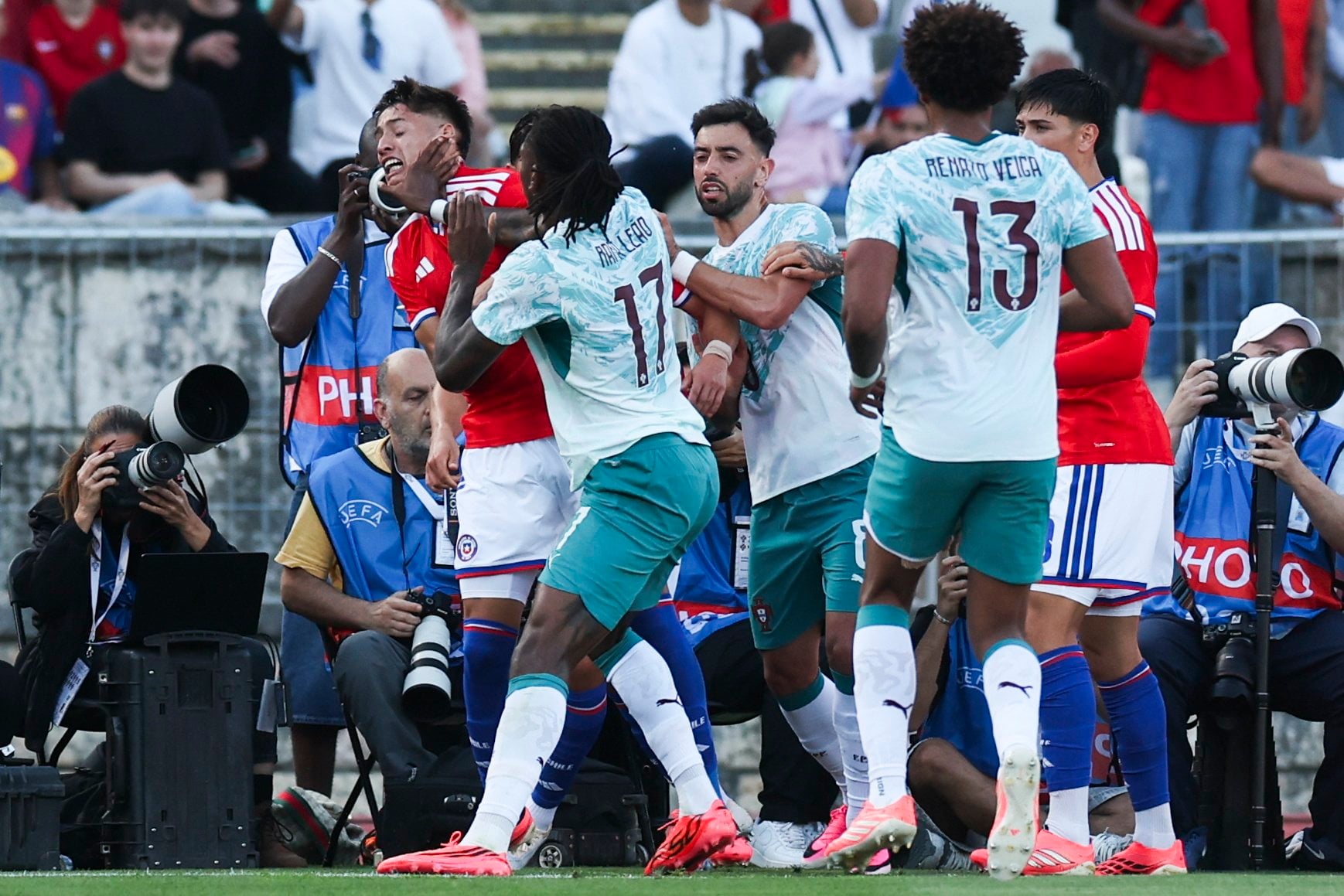 Portugal’s Rafael Leao and Chile’s Ivan Roman clash during their side’s World Cup warm-up at National Stadium, in Oeiras, Portugal. EPA