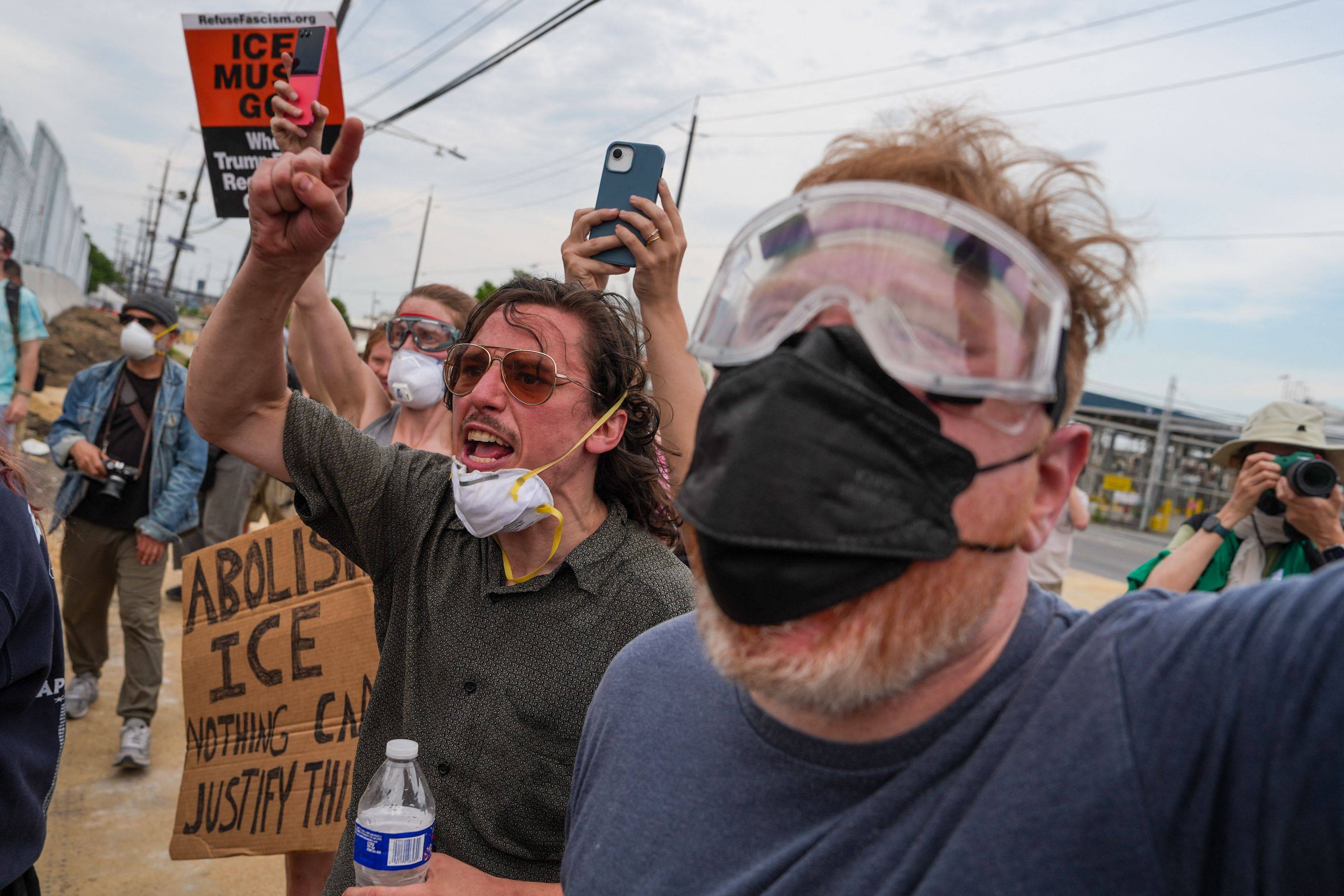 Protesters shout at Immigration and Customs Enforcement (ICE) agents outside Delaney Hall, which is being used as an ICE detention center, in Newark, New Jersey on Saturday. Photo: AFP