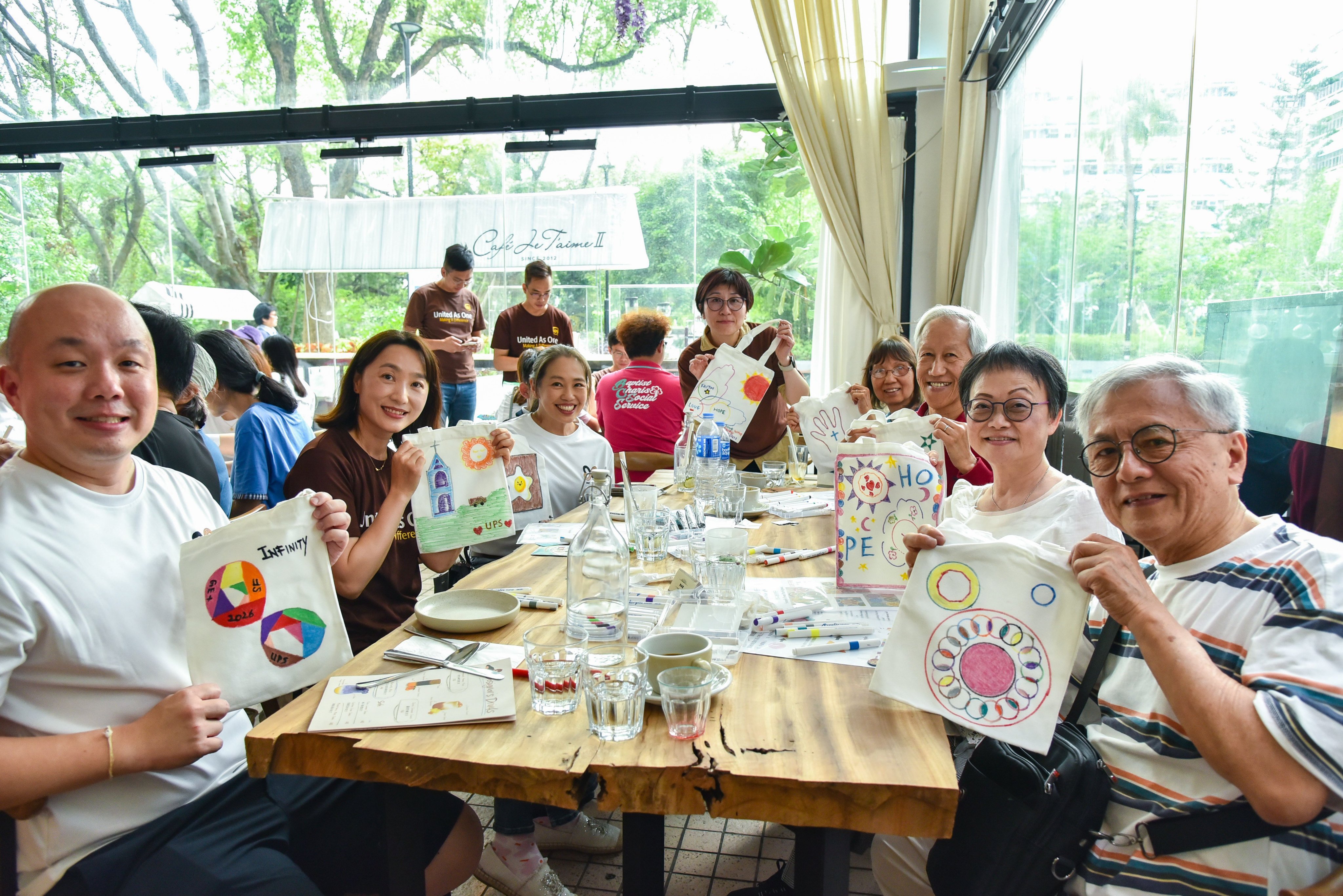 Chan Pui-lin (second from right) and other Wang Fuk Court residents enjoy a tea party hosted by Tai Po Baptist Church Social Service. Credit: TPBCSS