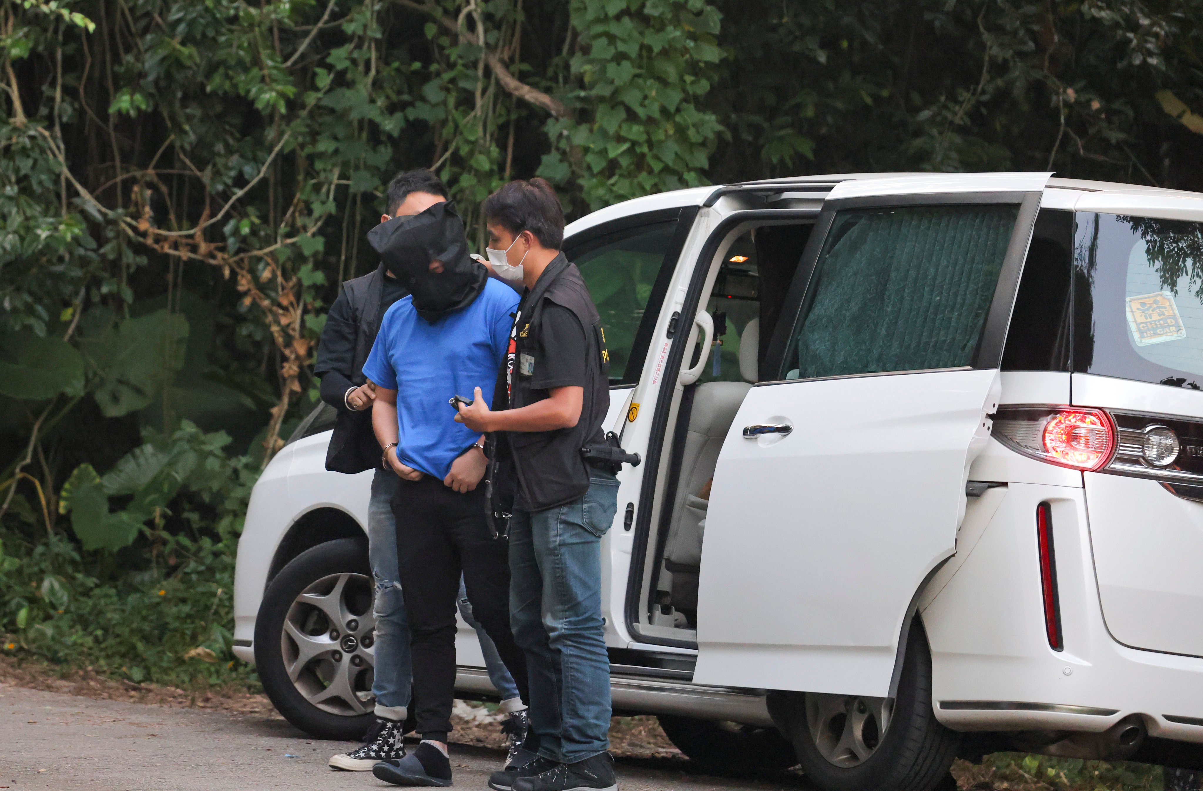 Police escort one of the suspects to Ping Yeung Village in Ta Kwu Ling back in 2022. Photo: Jelly Tse