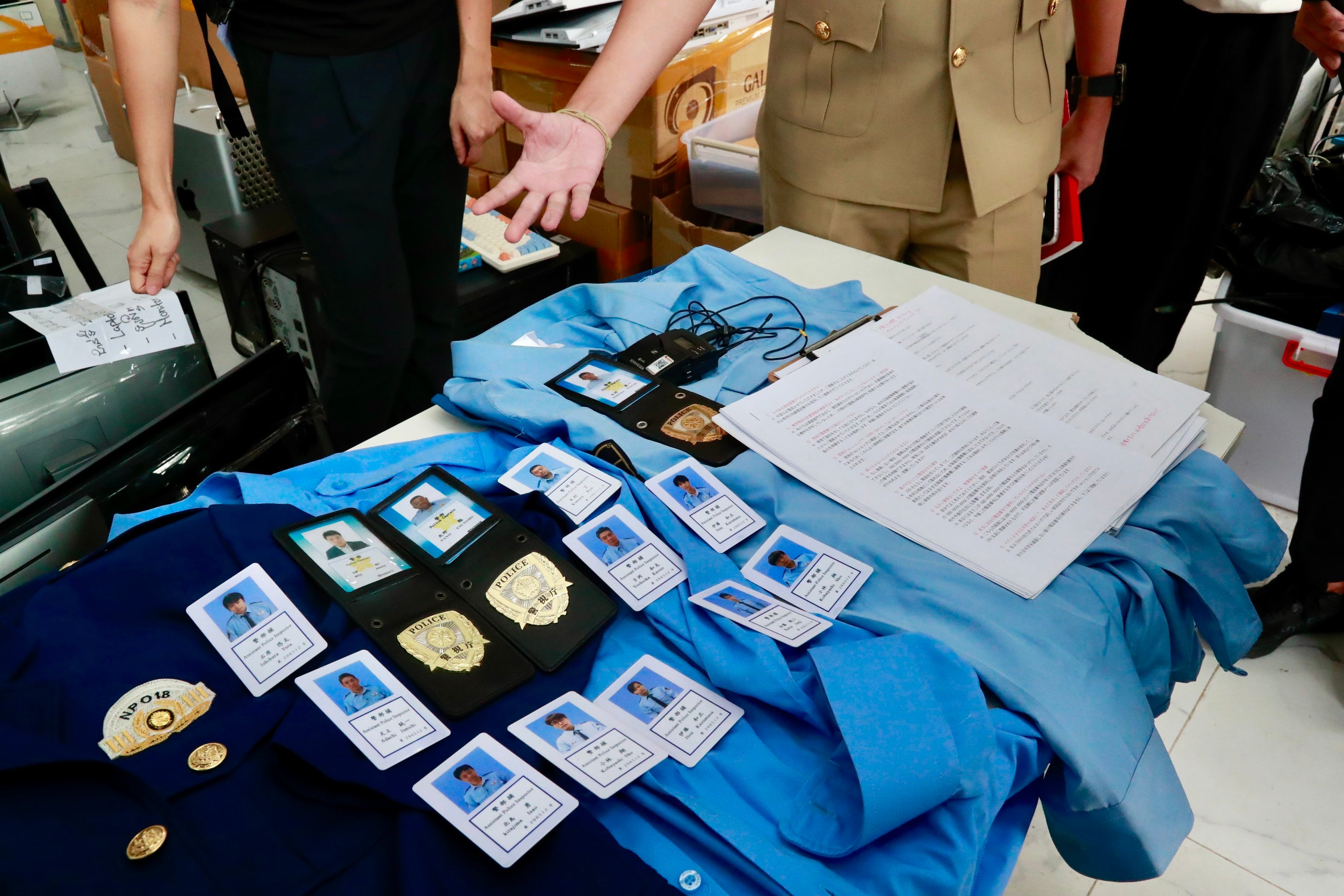 Cambodian authorities display equipment seized from a scam compound in Phnom Penh on March 11. Photo: EPA