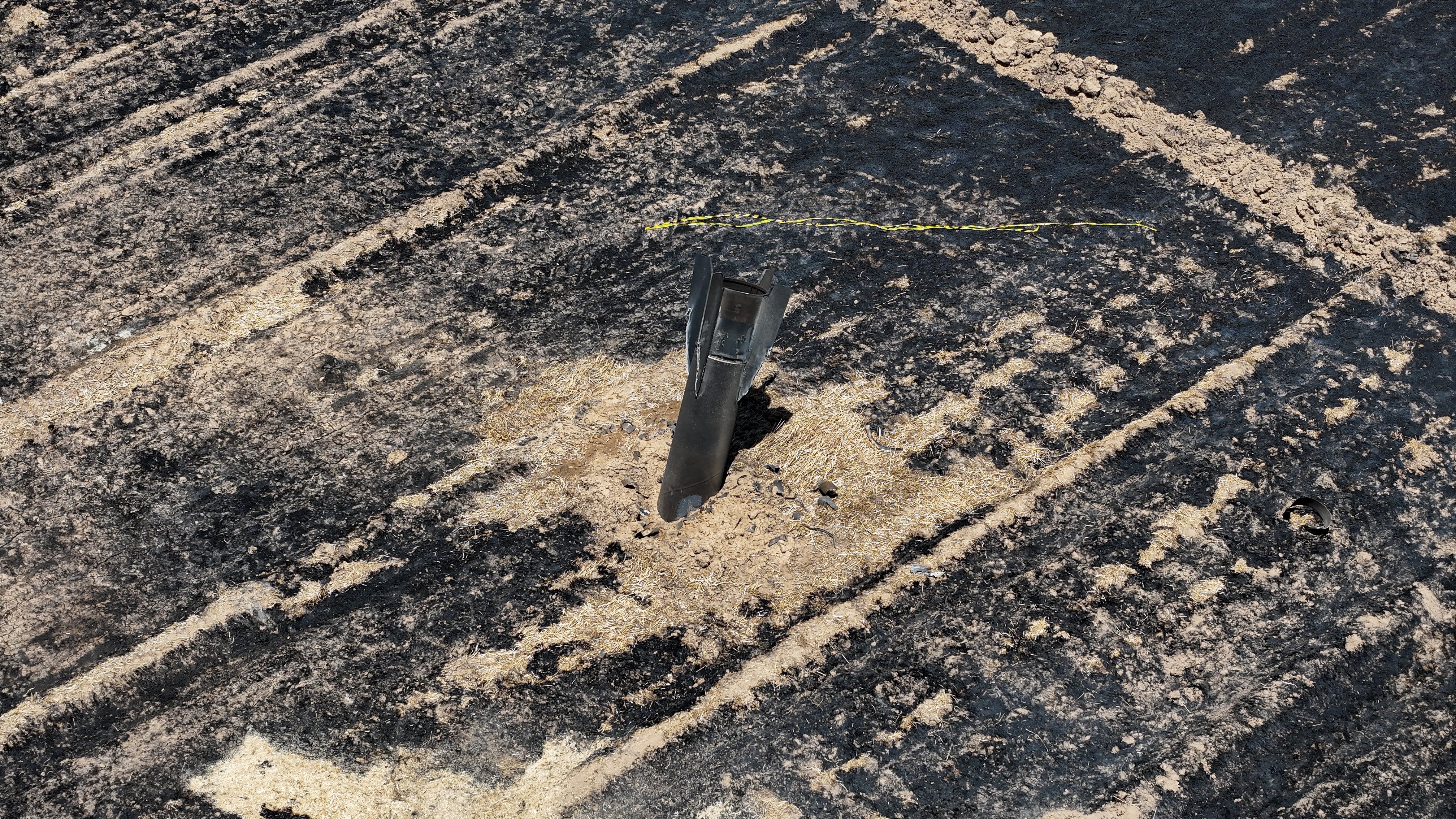 The remains of an Israel-bound Iranian ballistic missile that landed in an agricultural field in the Damascus countryside, Syria, following Monday's exchange of fire. Photo: EPA