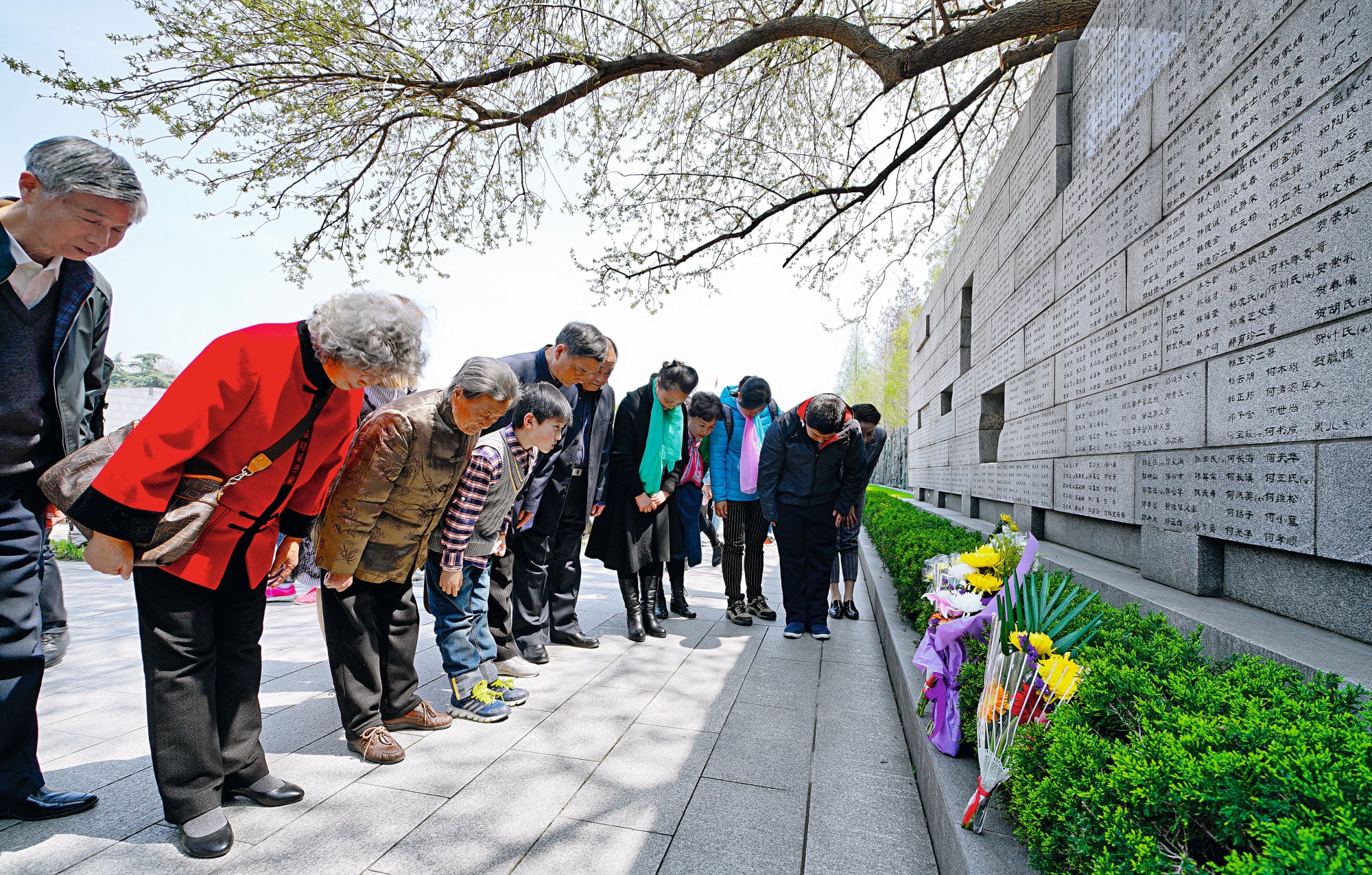 Survivors of the Nanking massacre and their relatives pay their respects at the Memorial Hall of the Victims in the Nanking Massacre by Japanese Invaders in Nanjing in China’s eastern Jiangsu province. Photo: Xinhua