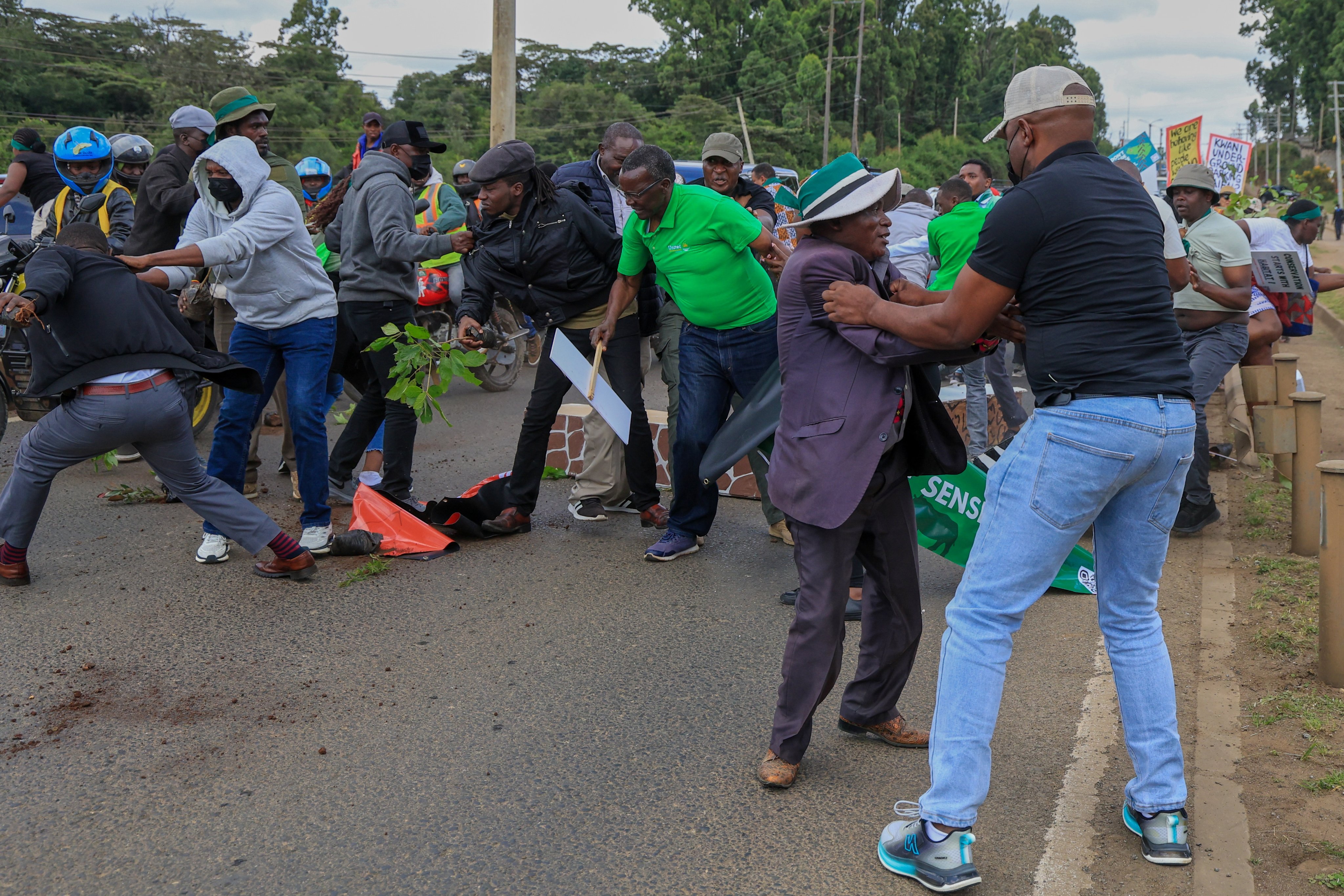 Plainclothes police officers arrest protesters during a demonstration against plans they say would affect wildlife habitat in Nairobi National Park in Nairobi, Kenya on Monday. Photo: AP