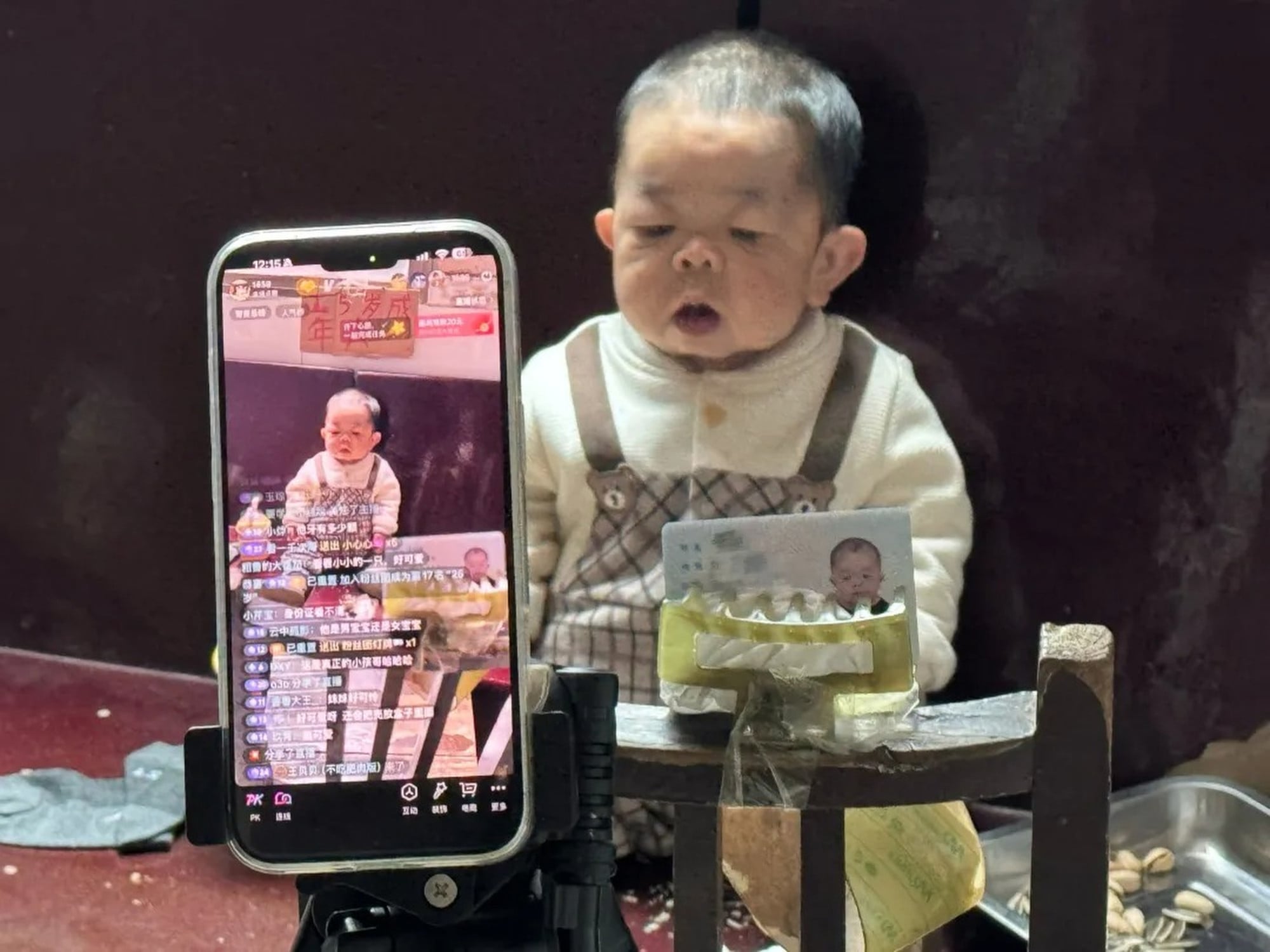 Tiny Wang’s image is caught on the screen of a mobile phone. Photo: Handout Tiny Wang’s image is caught on the screen of a mobile phone. Photo: Handout