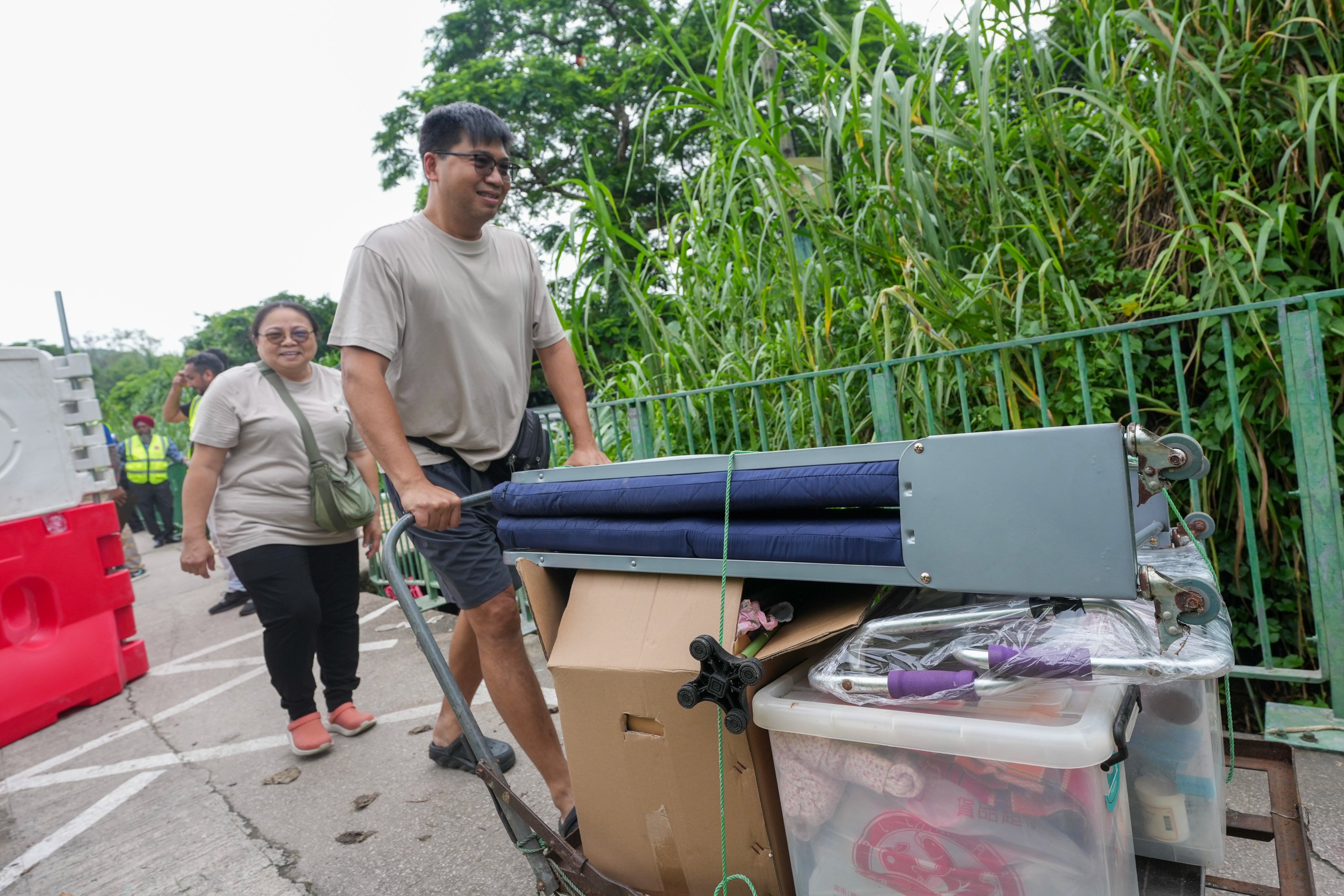 Tin Sam Tsuen villagers carry their belongings away after the standoff. Photo: Karma Lo