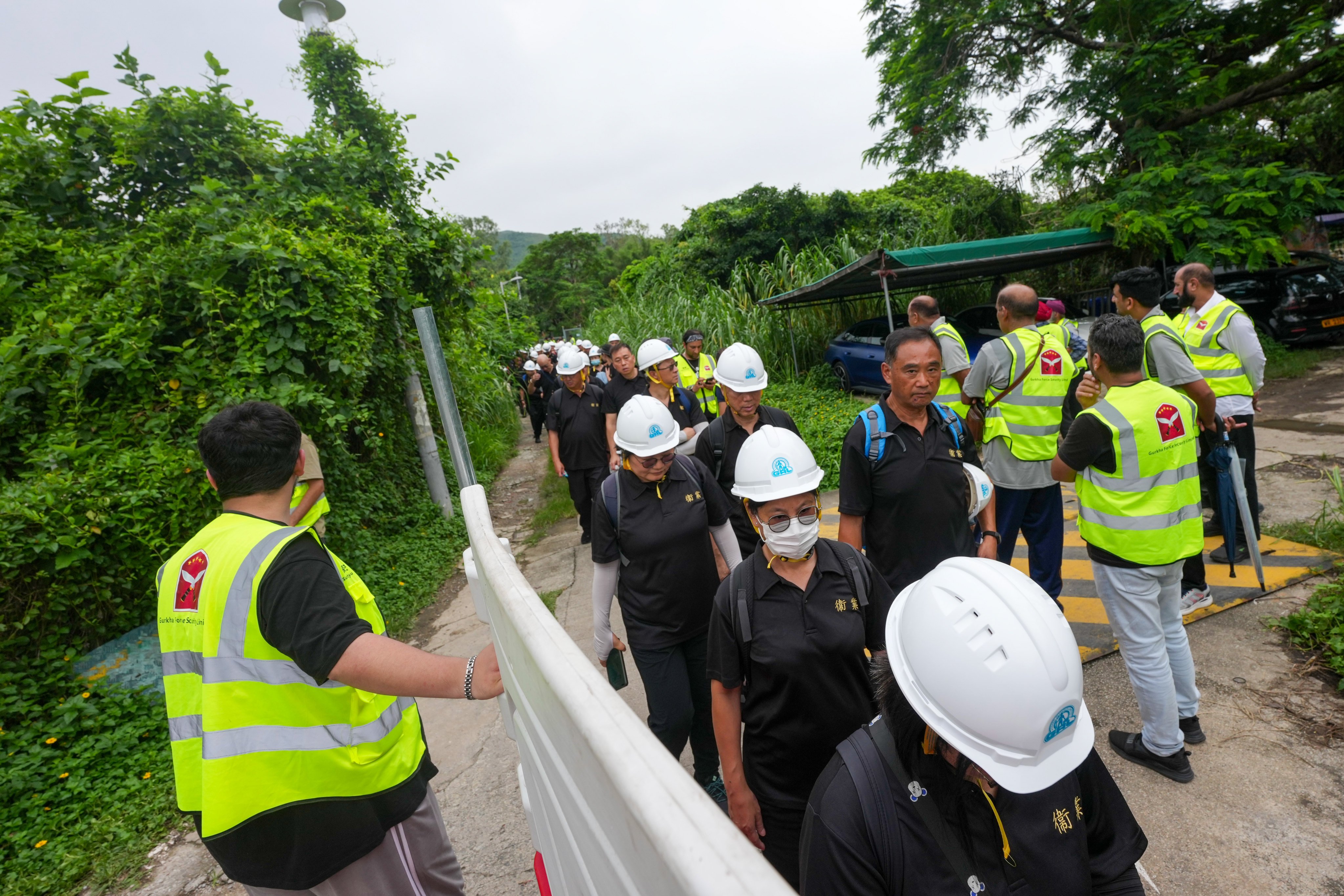 Lands Department officials and security guards evict residents of Tin Sam Tsuen. Photo: Karma Lo