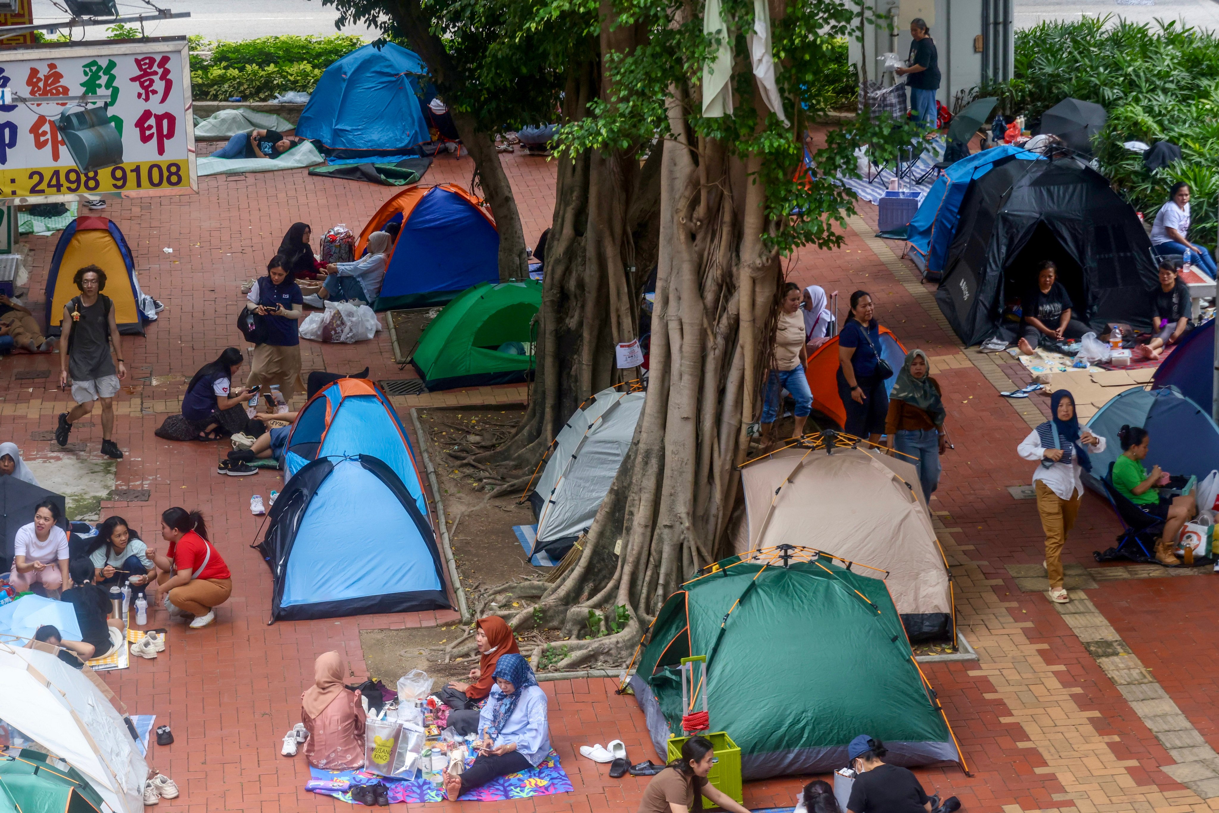 Domestic workers gather around tents in Tsuen Wan on their day off on May 24. Photo: Jonathan Wong