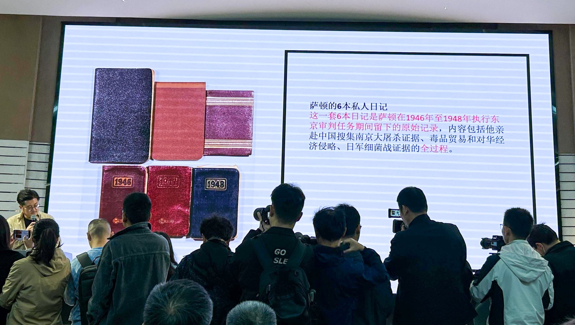 Chinese historian Zou Dehuai talks about the diaries of American lawyer David Nelson Sutton at the Memorial Hall of the Victims in the Nanking Massacre by Japanese Invaders in Nanjing on April 29. Photo: Xinlu Liang
