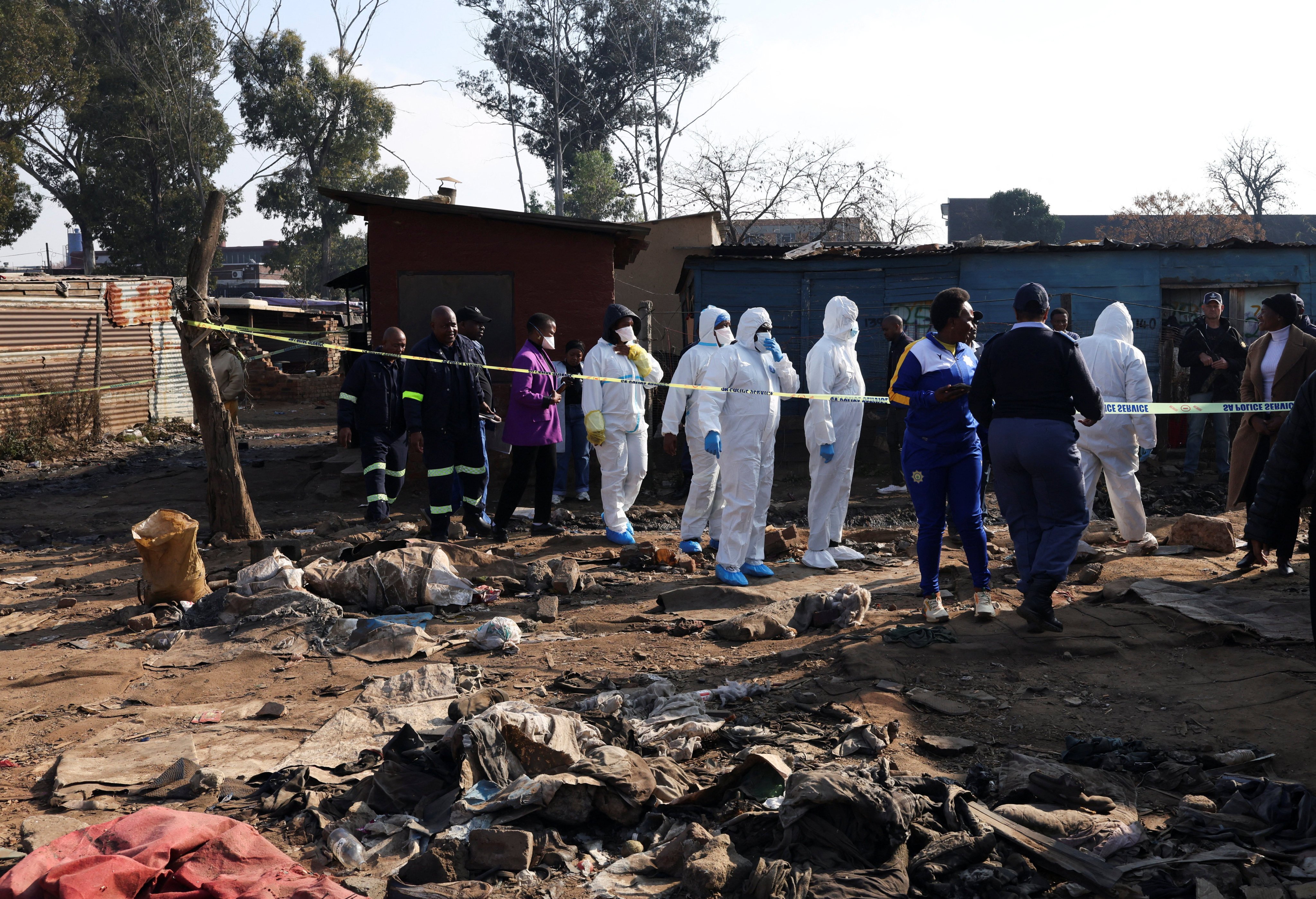 Forensics teams at the scene after the shootings. Photo: Reuters