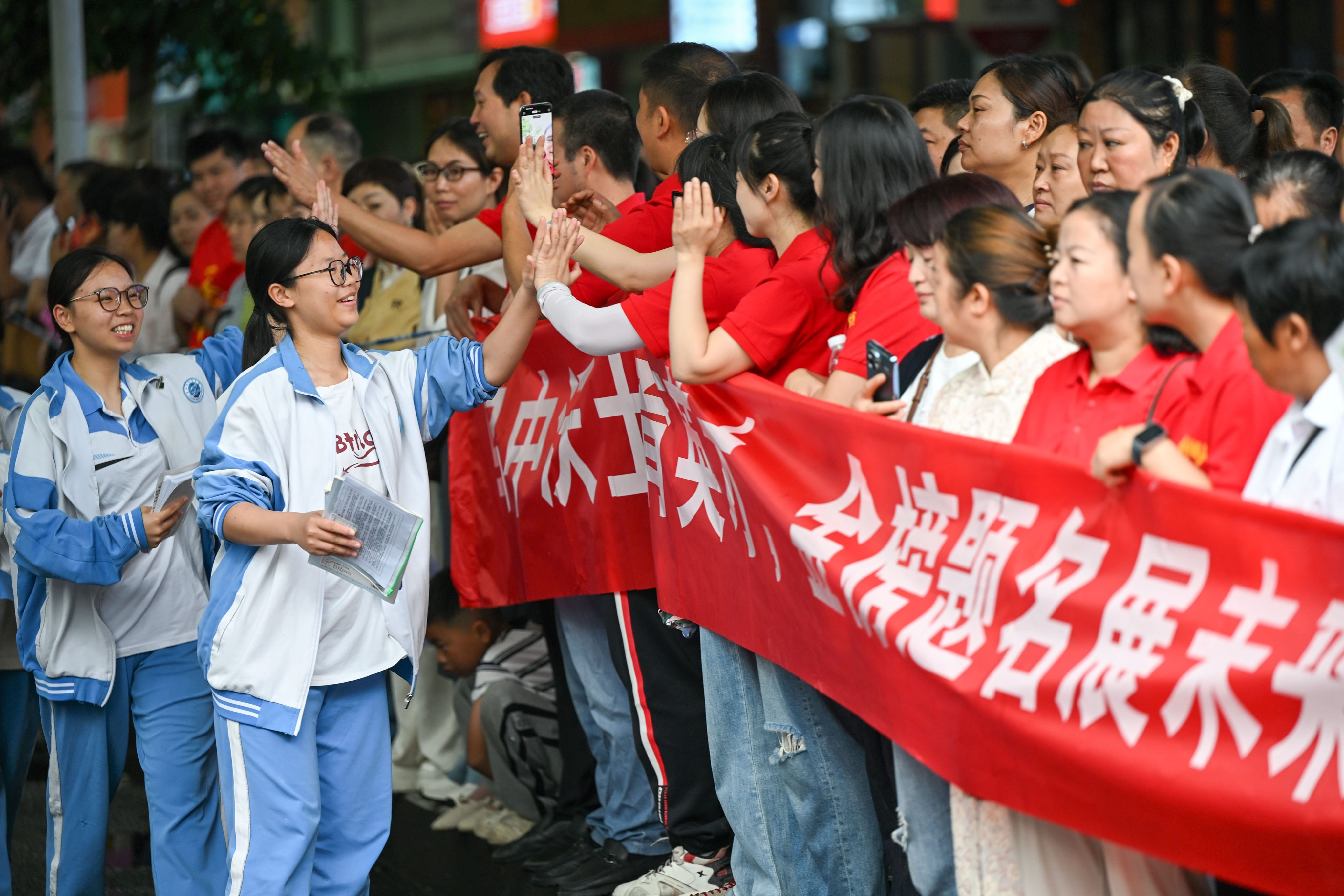 Students give their teachers a high five before entering the examination hall for the 2026 National Higher Education Entrance Examination, or gaokao, in Guiyang city, Guizhou province, on June 8. Photo: Xinhua