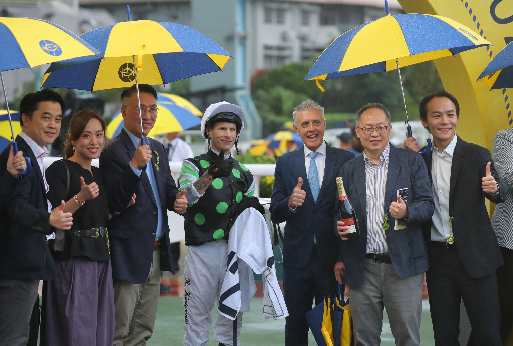 Connections of Incredible Moment celebrate his maiden win. Connections of Incredible Moment celebrate his maiden win.