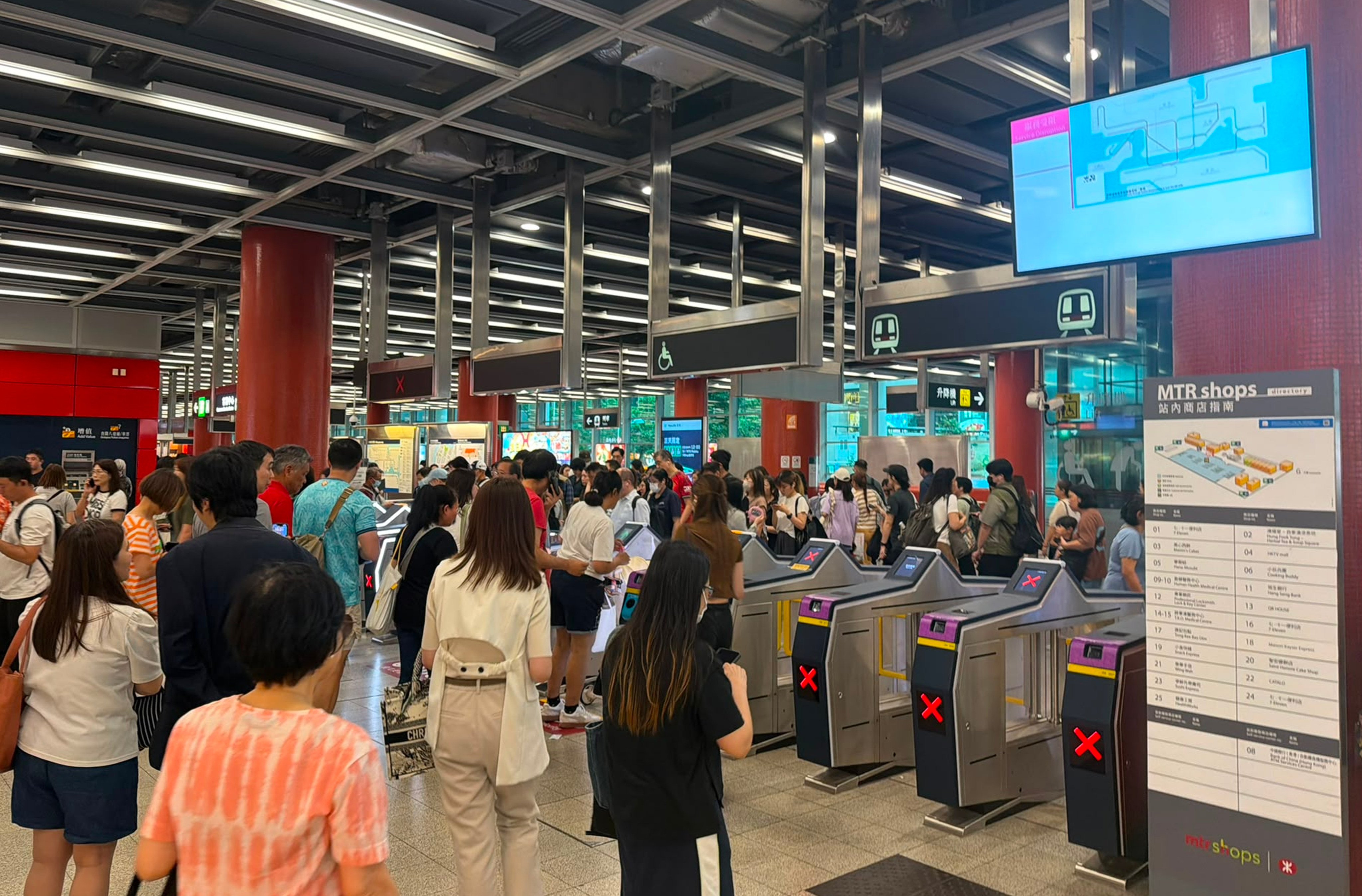 Passengers wait outside Tseung Kwan O station. Photo: Handout