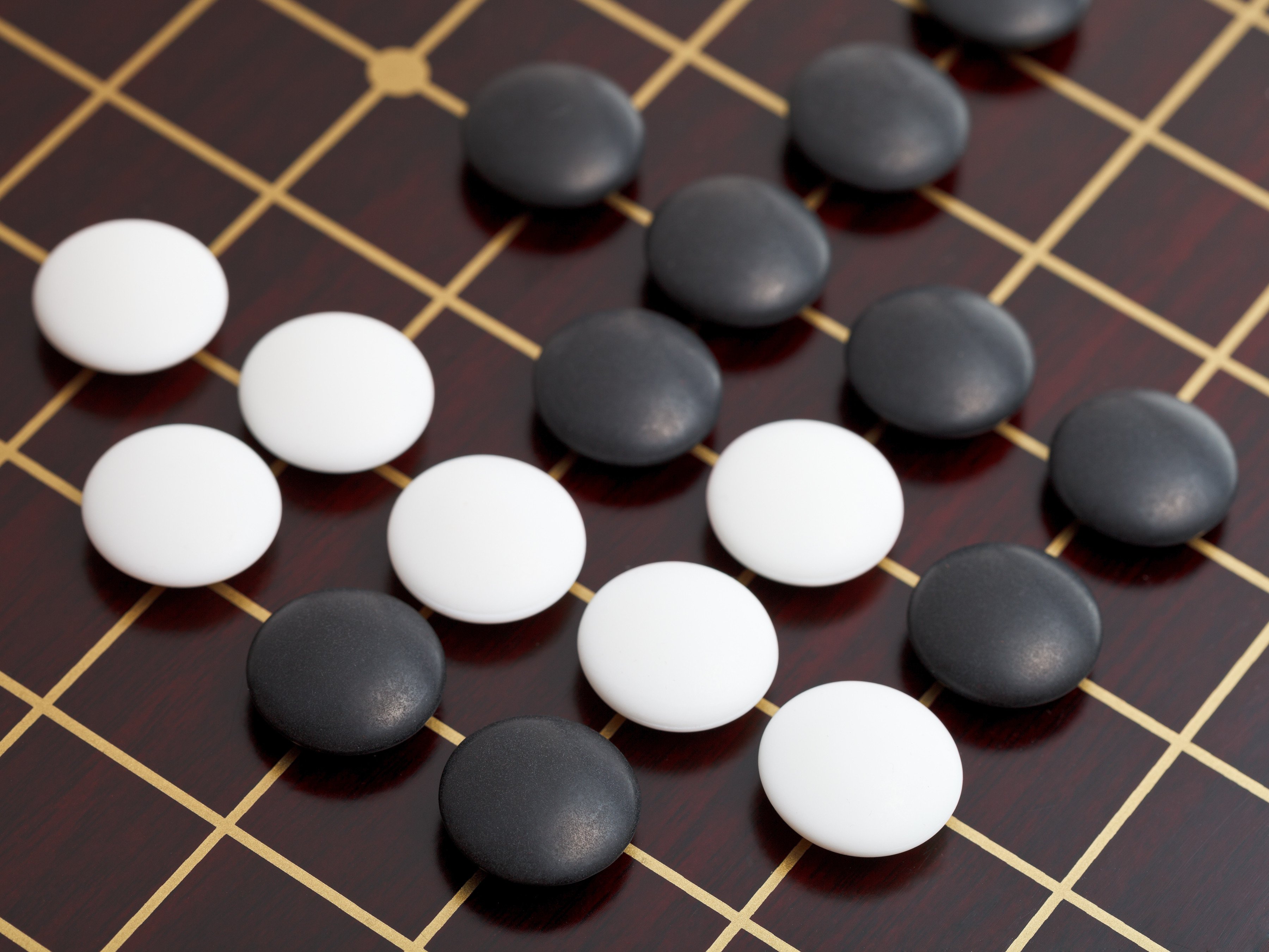 Weiqi, better known in the West by its Japanese name, go, is played by two opponents using black and white stones on a board marked with a 19-by-19 grid, creating 361 intersections. Its history dates back more than two millennia. Photo: vvoe/Shutterstock