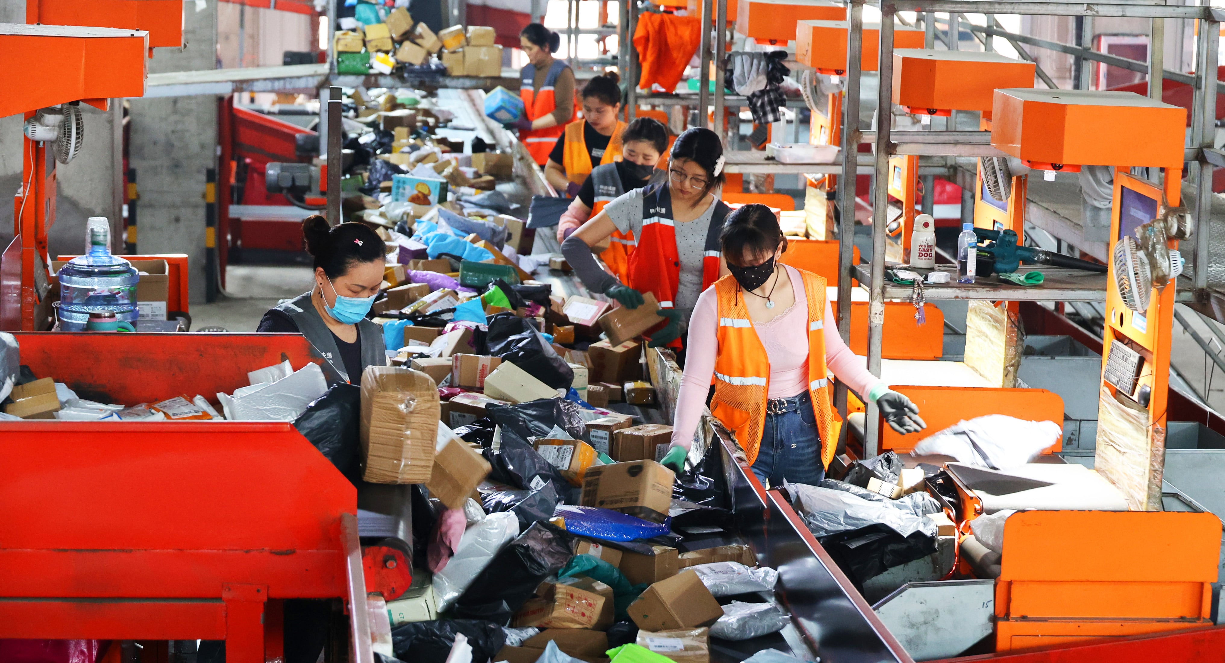 Workers sort express packages at a distribution centre in Lianyungang in China's Jiangsu Province. The express delivery industry is ramping up operations ahead of the  '618' online shopping festival. Photo: Getty Image