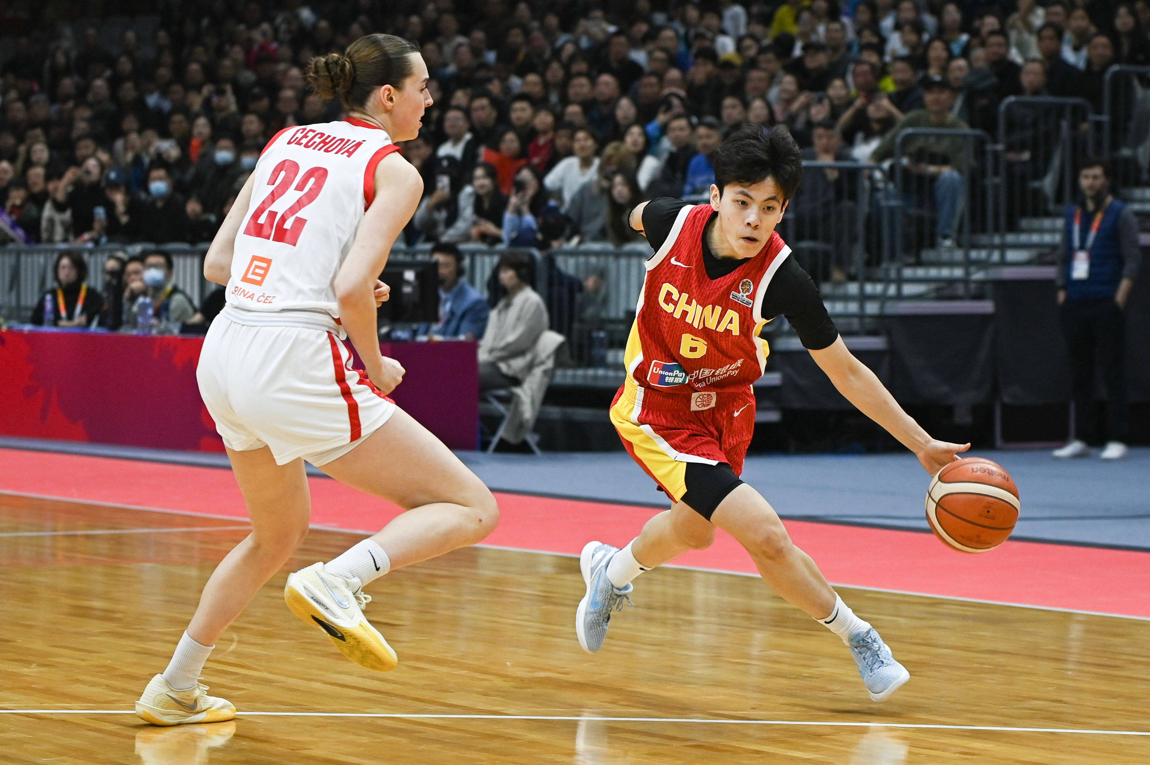 China’s Shuyu Yang (right) dribbling against the Czech Republic at the Fiba Women’s Basketball World Cup qualifying tournament in Wuhan, in March. Photo: AFP