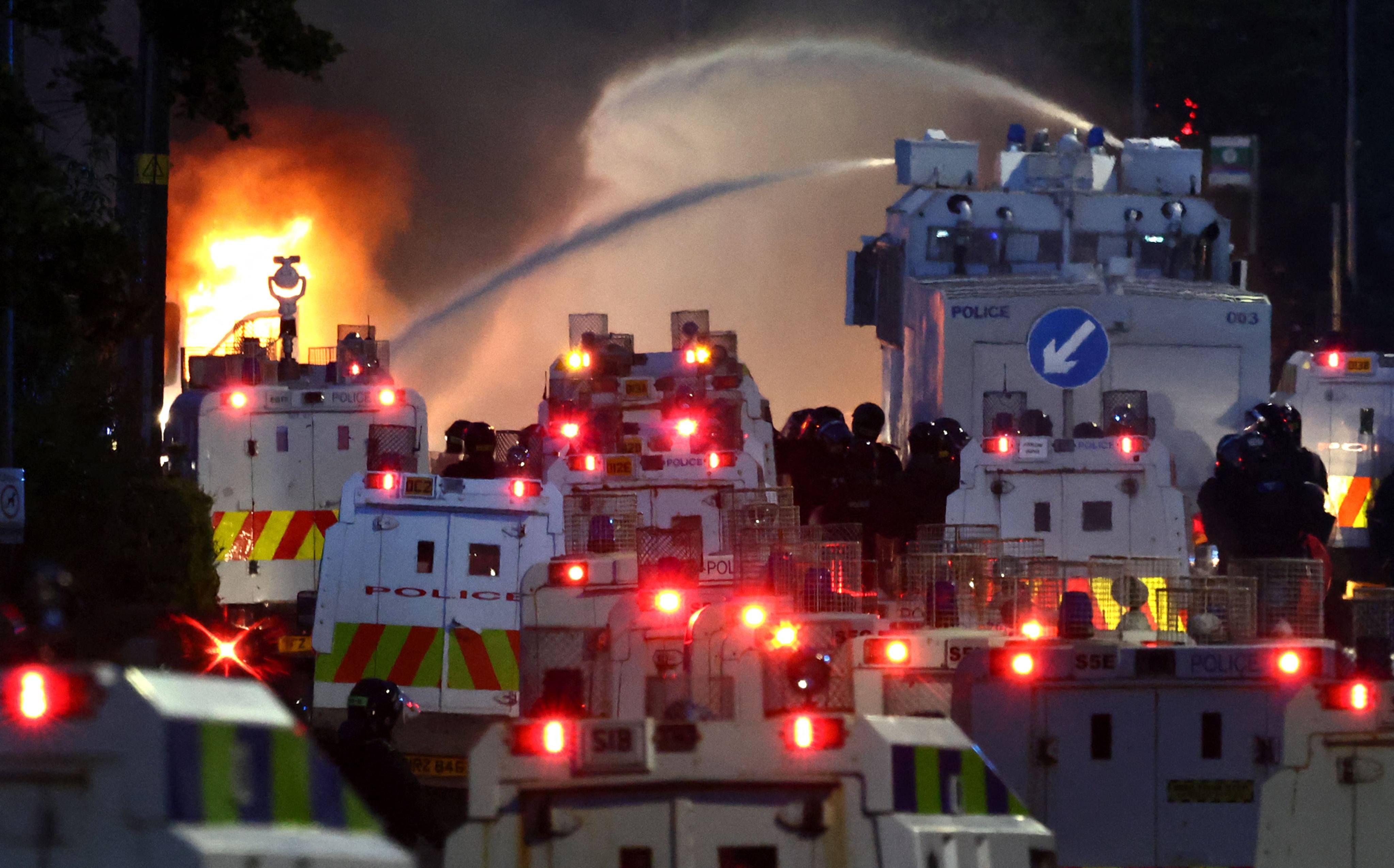 Police use a water cannon. Photo: AFP