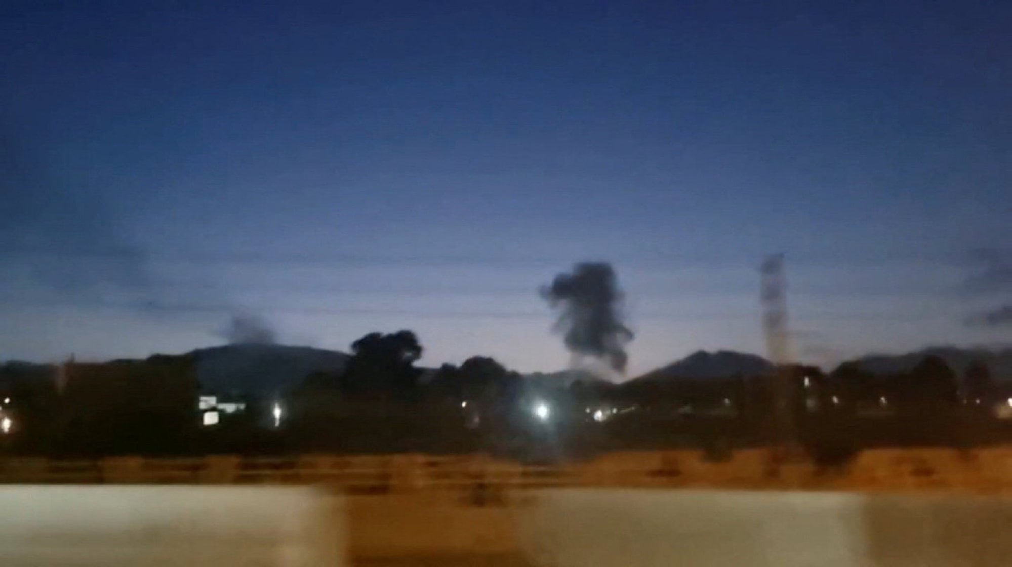 A plume of smoke rises in Karaj, Iran. Photo: Social media via Reuters A plume of smoke rises in Karaj, Iran. Photo: Social media via Reuters