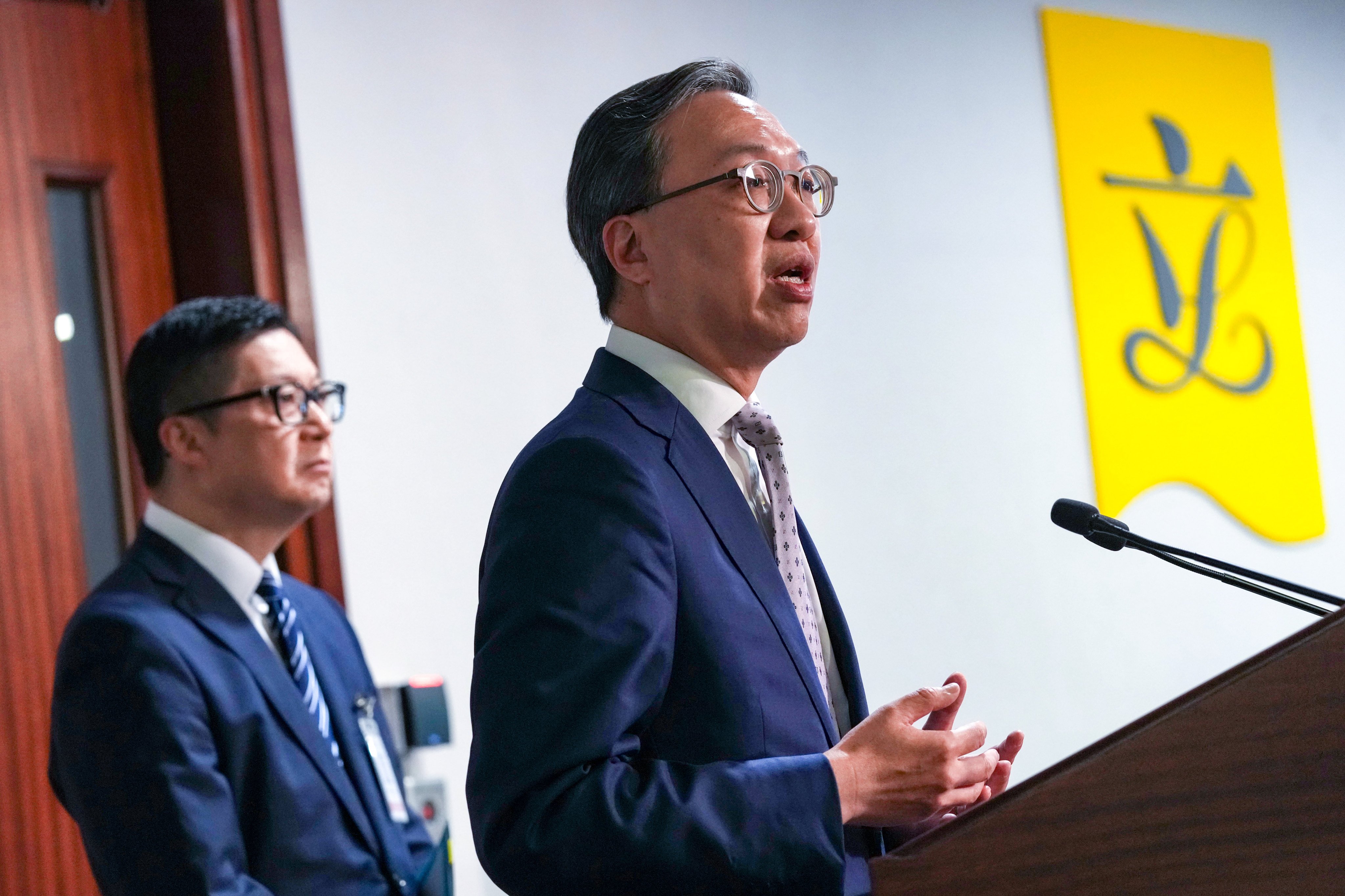 Secretary for Security Chris Tang (left) and Secretary for Justice Paul Lam speak to the media at the Legco building in Admiralty on Thursday. Photo: Jelly Tse