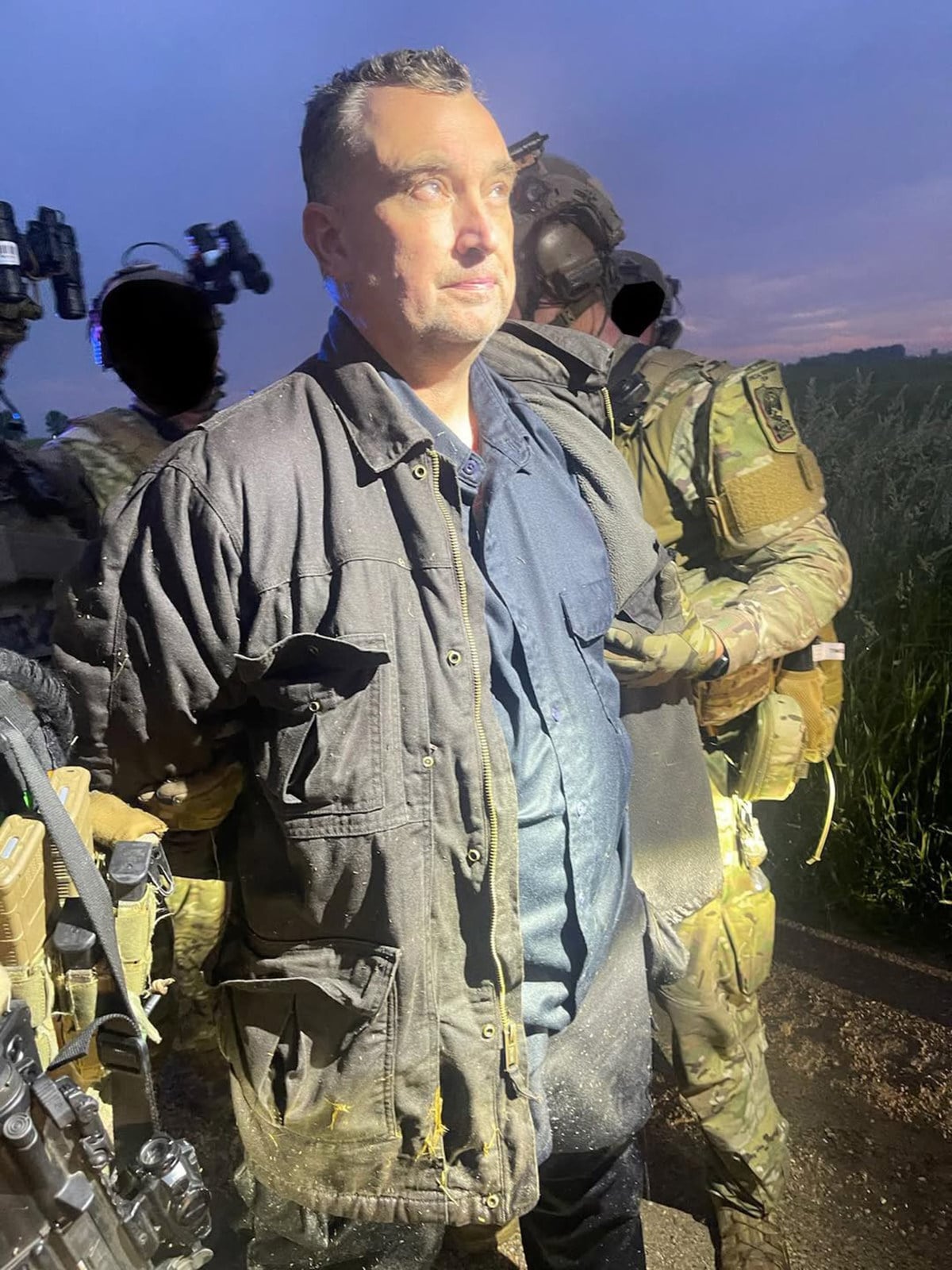 Vance Boelter is surrounded by heavily armed tactical officers after being taken into custody in June 2025. Photo: Ramsey County Sheriff’s Office via TNS