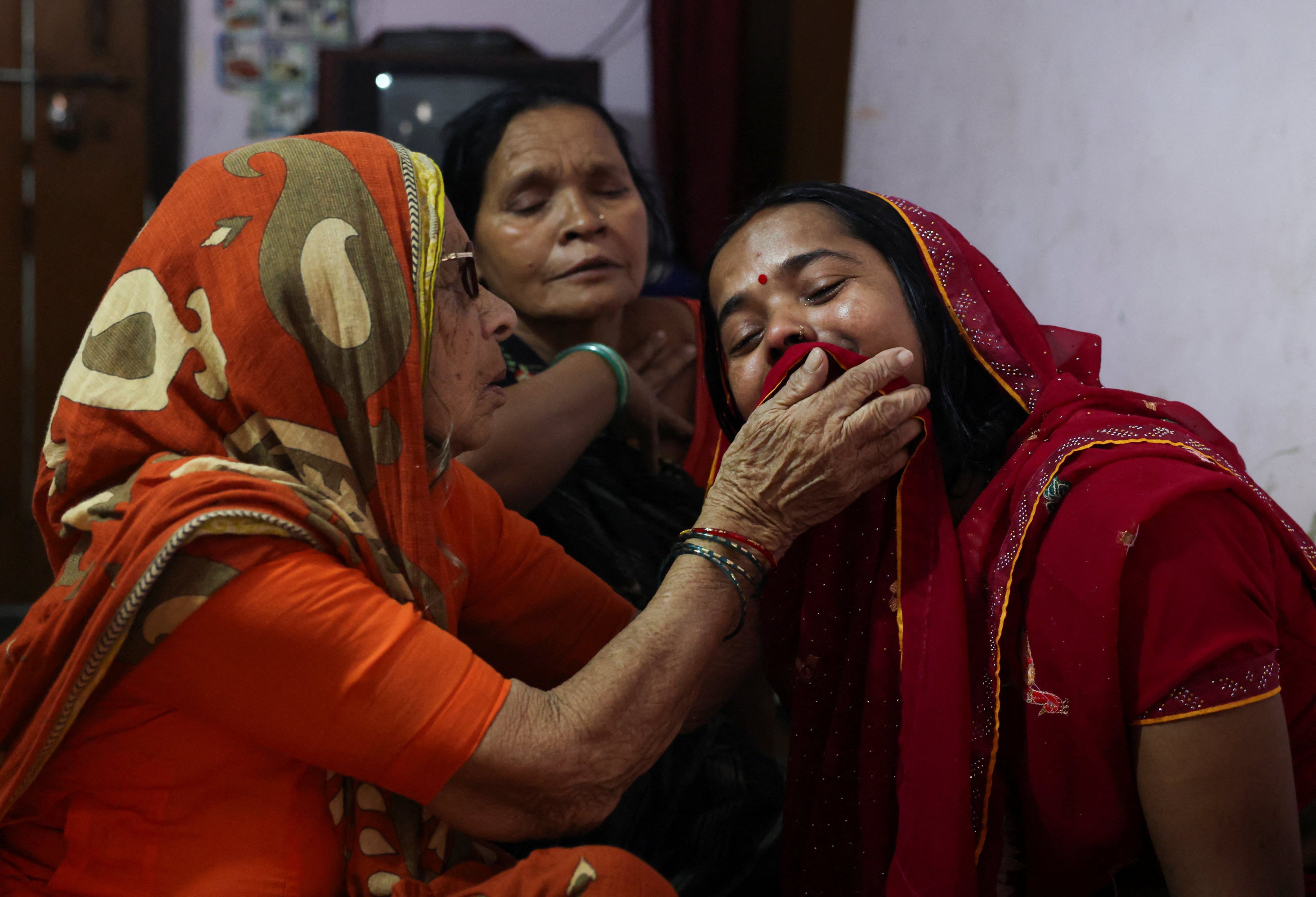 Sushila Devi, wife of Shivanand Chaurasia, mourns her husband in Deoria, Uttar Pradesh, on Friday. Photo: Reuters