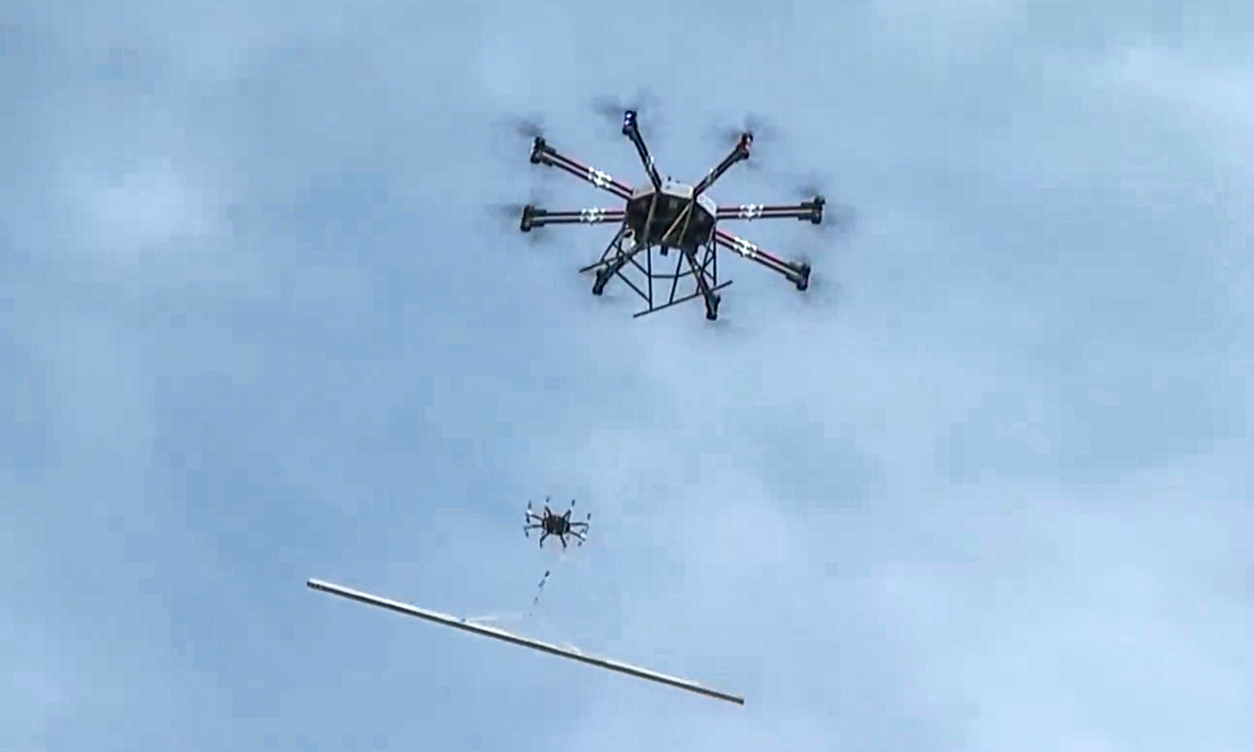 Heavy-lift drones transport construction materials up a remote mountain in southwest mainland China. Photo: CCTV