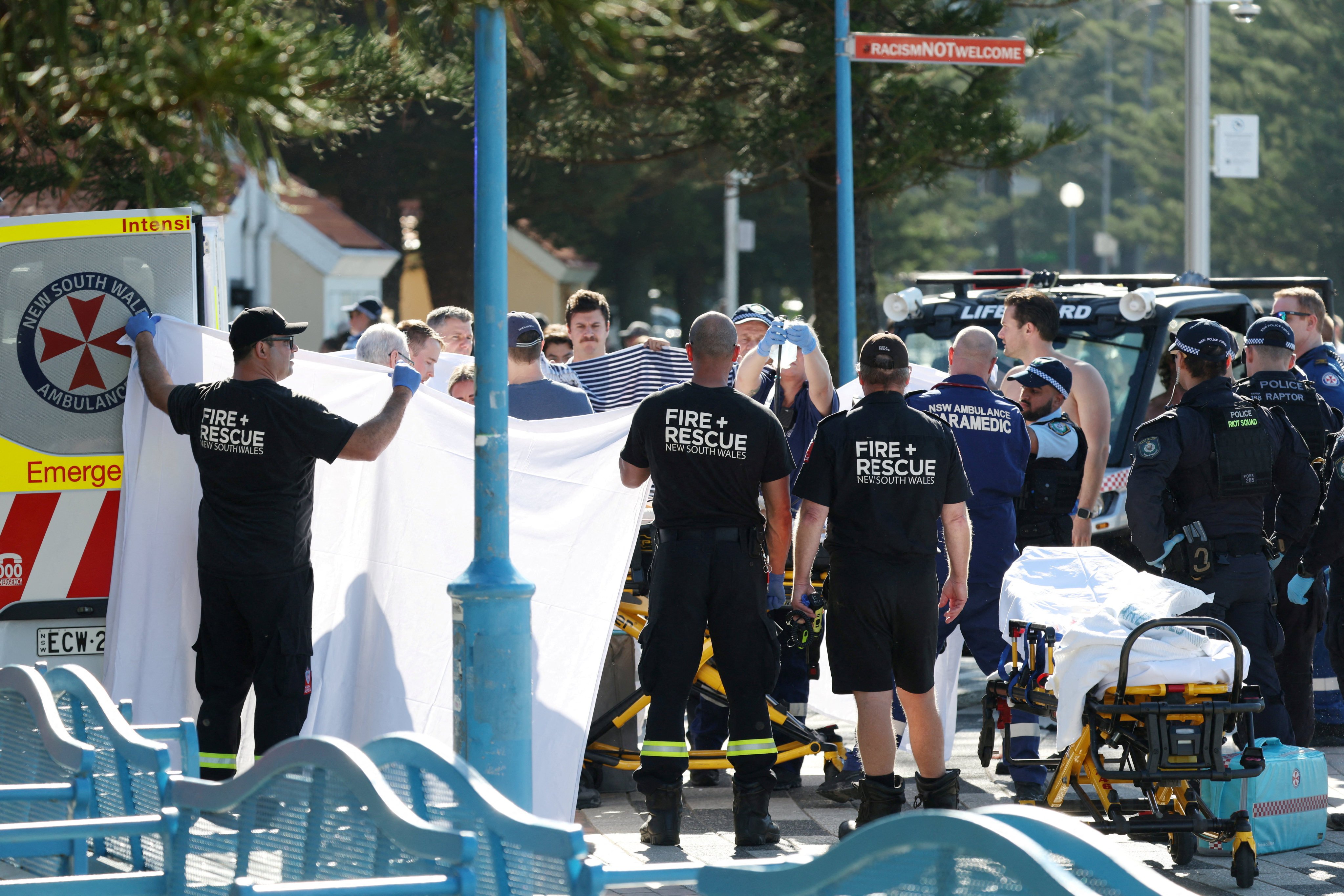 Emergency personnel attend the scene of a shark attack at Coogee Beach in Sydneyon Saturday. Photo: Reuters