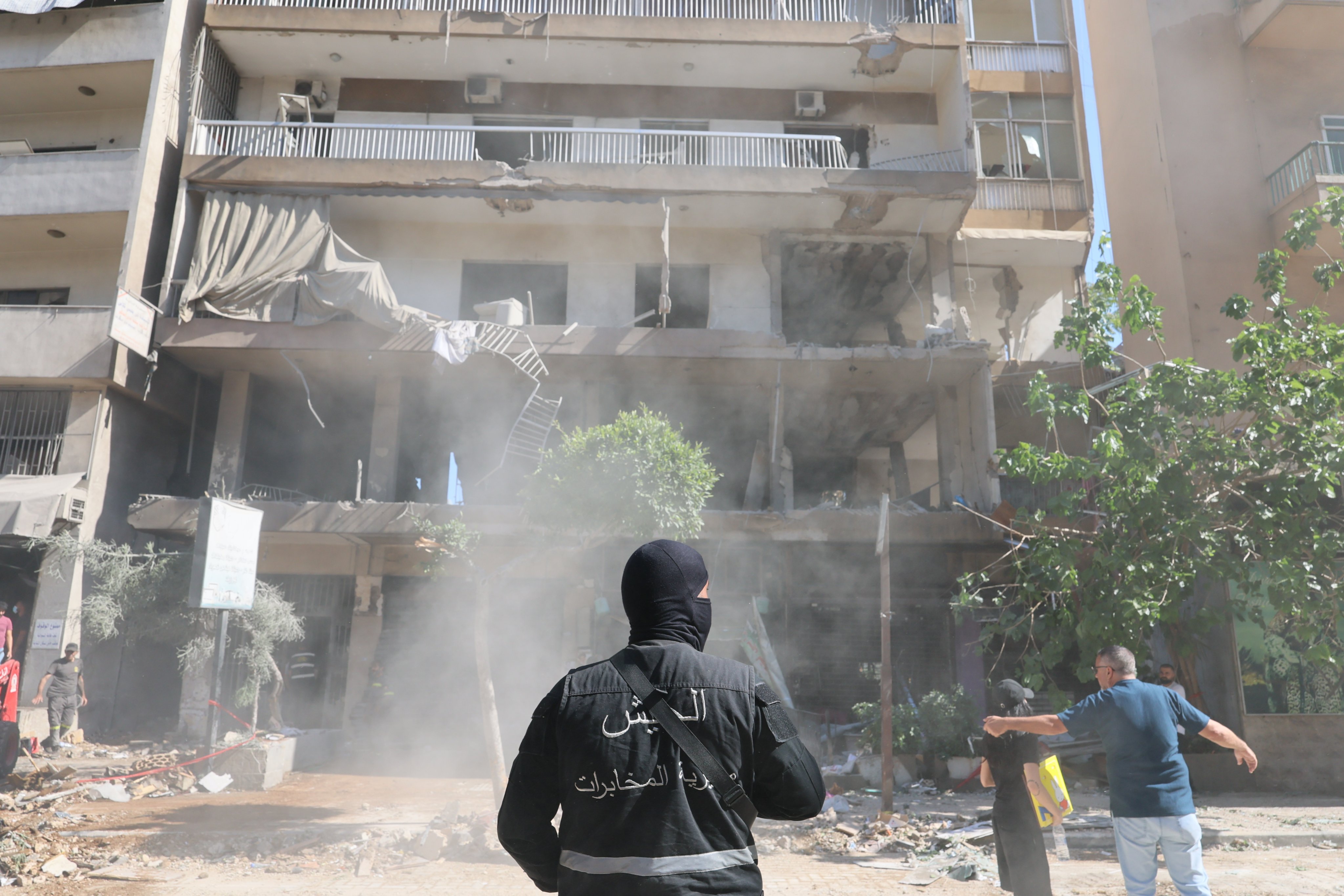 A Lebanese security serviceman stands near the site of a flat targeted by an Israeli airstrike in Beirut’s southern suburbs, Lebanon, on Sunday. Photo: EPA-EFE