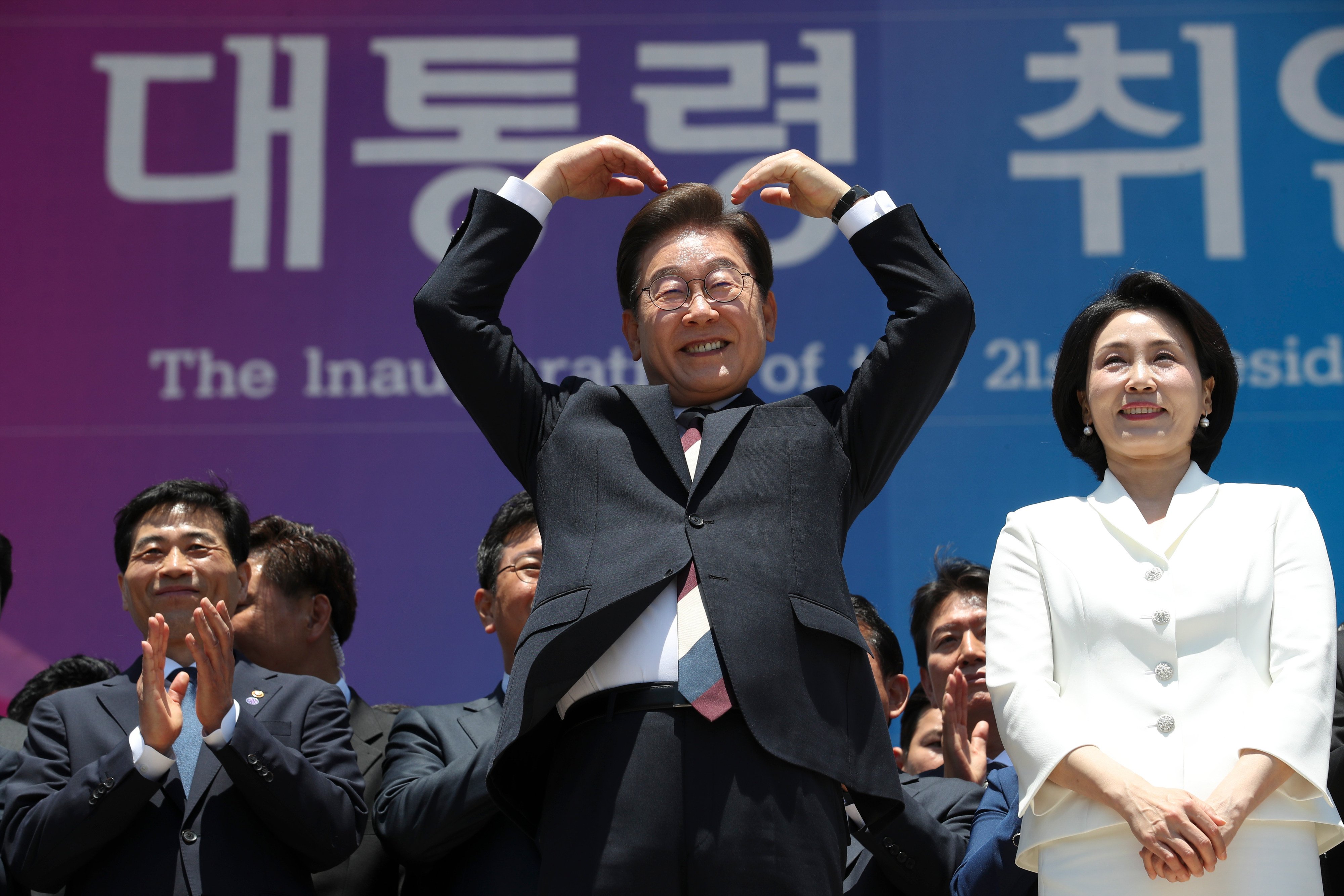 South Korean President Lee Jae Myung and his wife Kim Hea-kyung gesture towards supporters at the National Assembly in Seoul last year. Photo: Xinhua