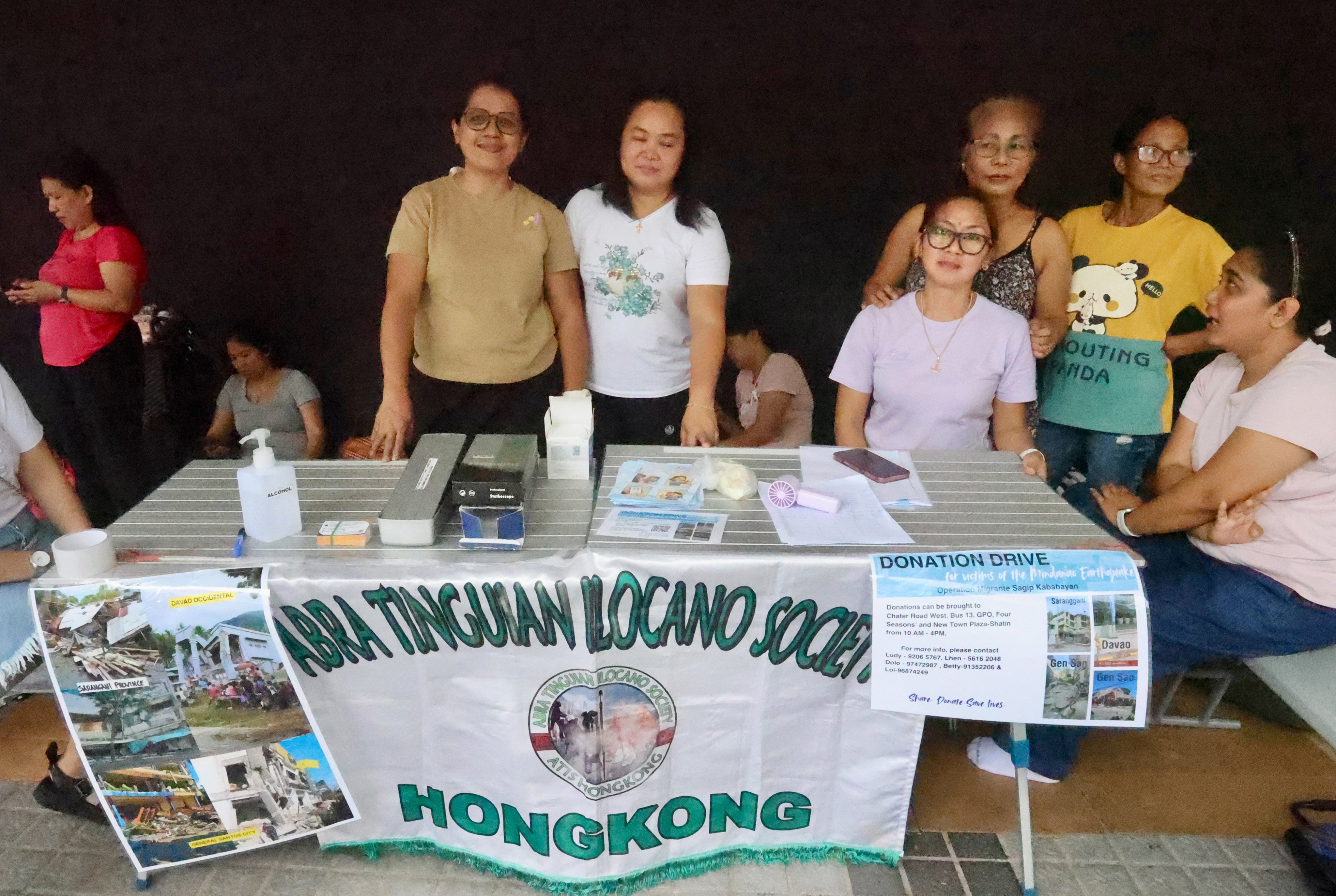 Filipino domestic workers have set up a donation booth outside City Hall in Central. Photo: Jonathan Wong
