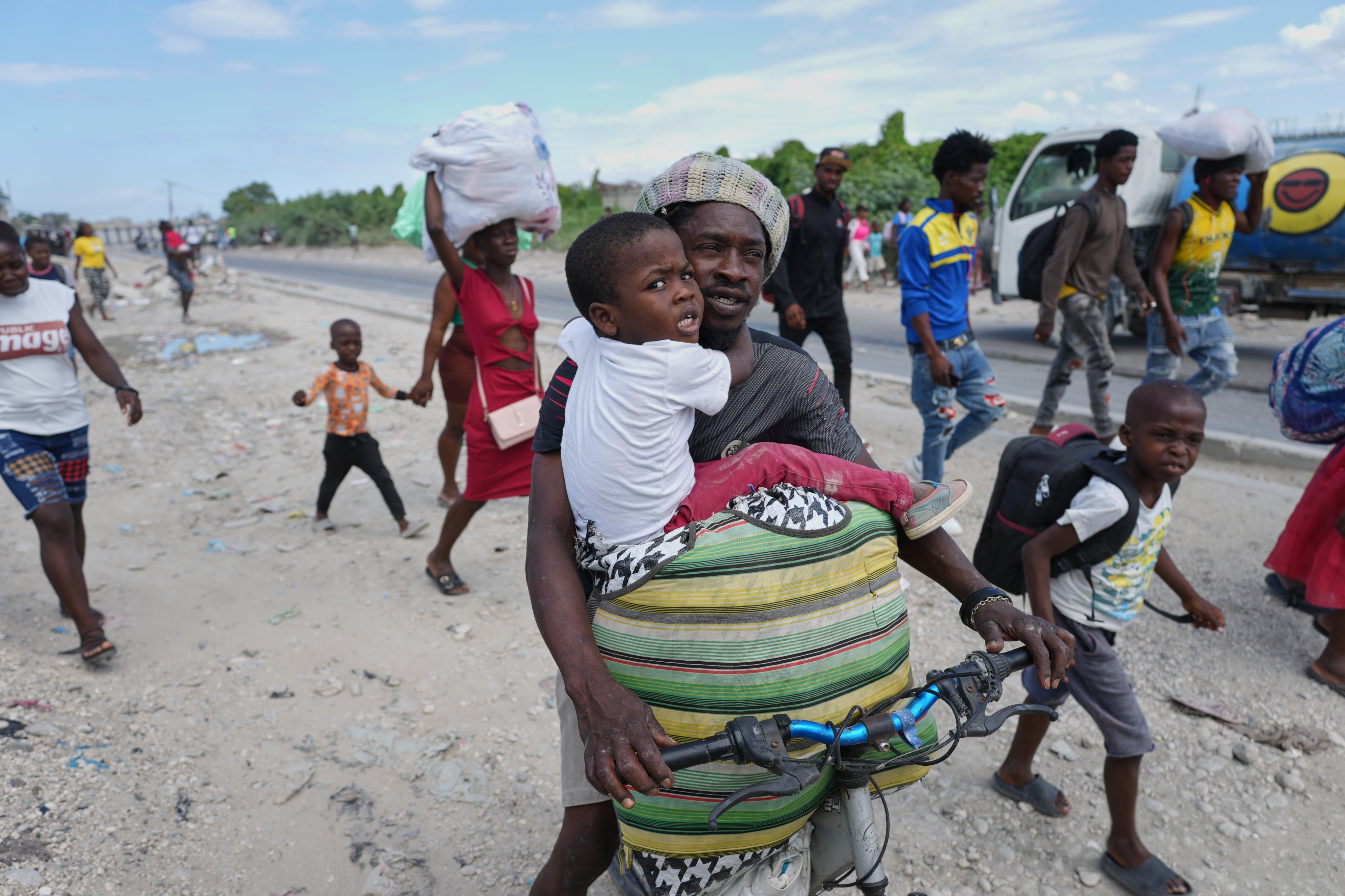 Residents flee their homes to escape clashes between armed gangs in Port-au-Prince, Haiti last month. Photo: AP