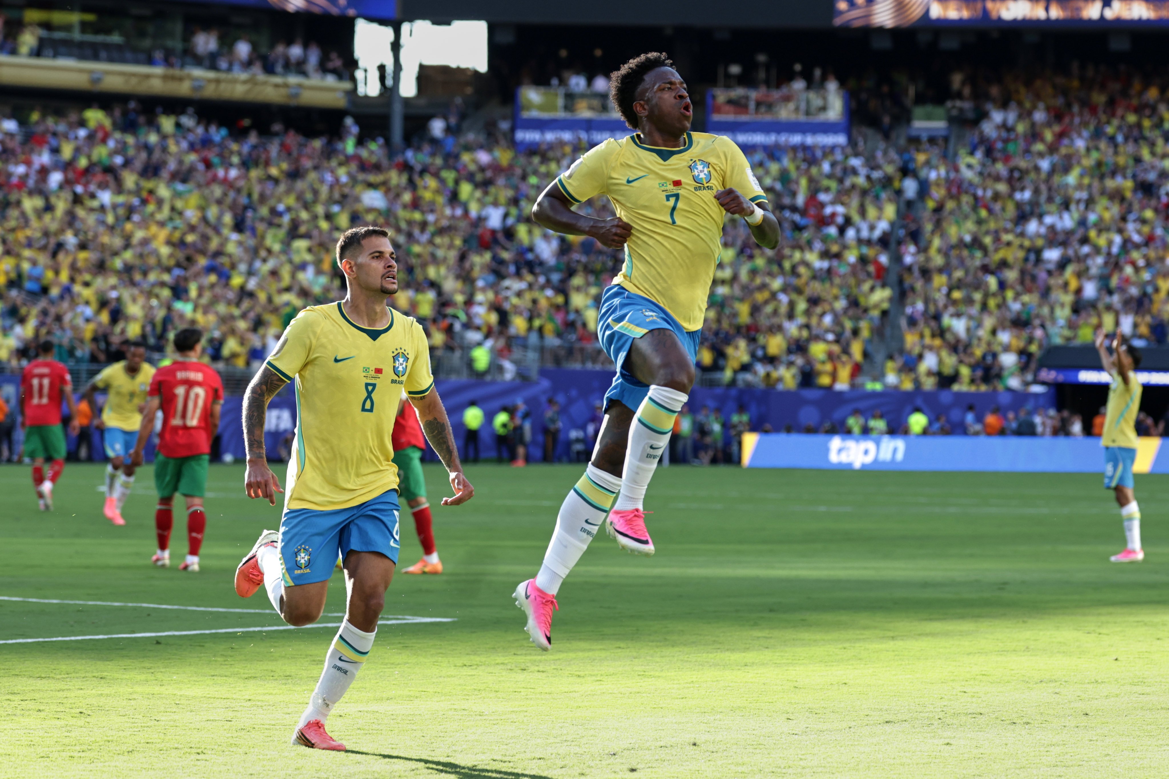 Brazil’s Vinicius Junior (right) celebrates with teammate Bruno Guimaraes after scoring their equaliser against Morocco on Sunday. Photo: AP