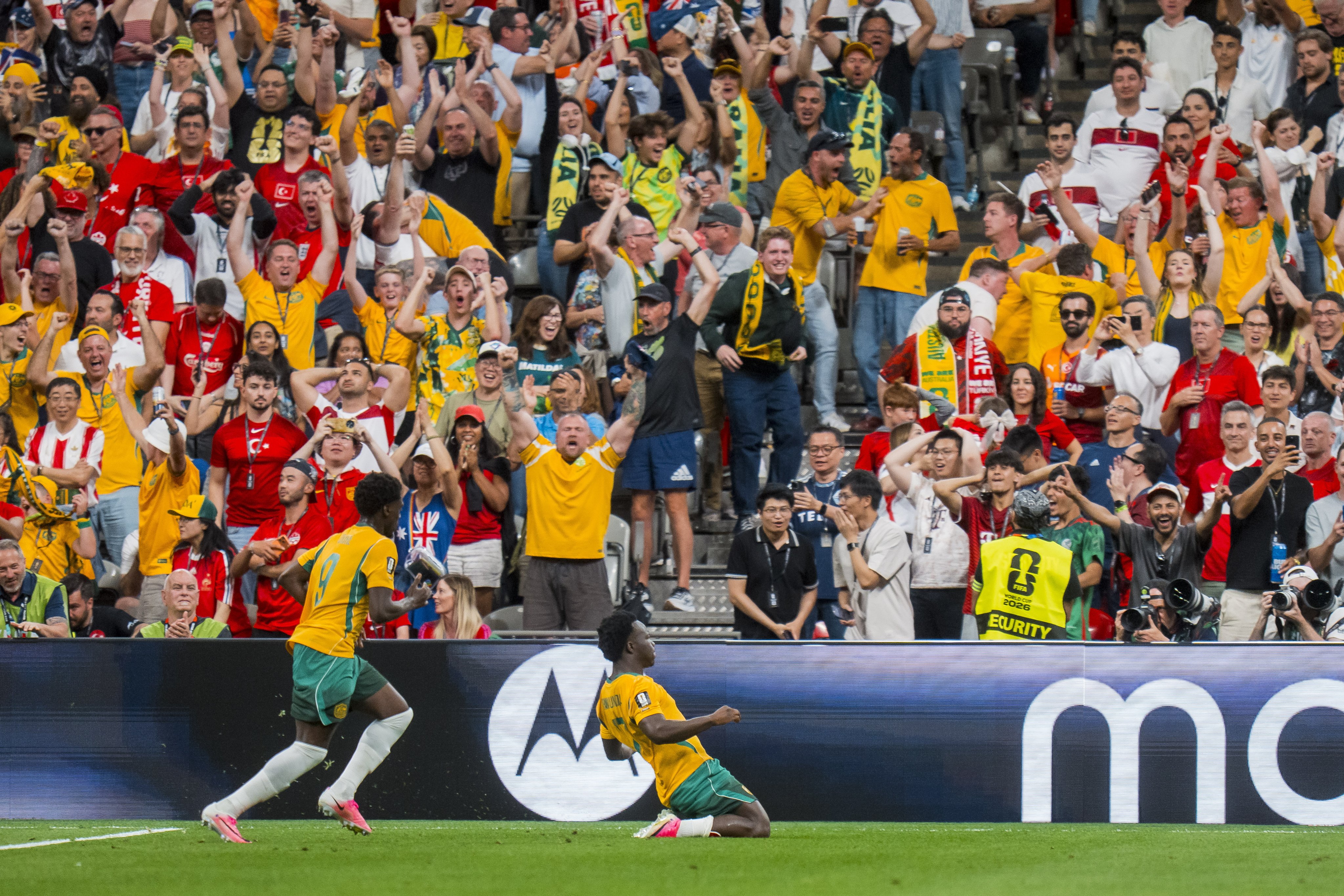 Nestory Irankunda (right) celebrates his goal in the first half during the World Cup match against Turkey. Photo: EPA