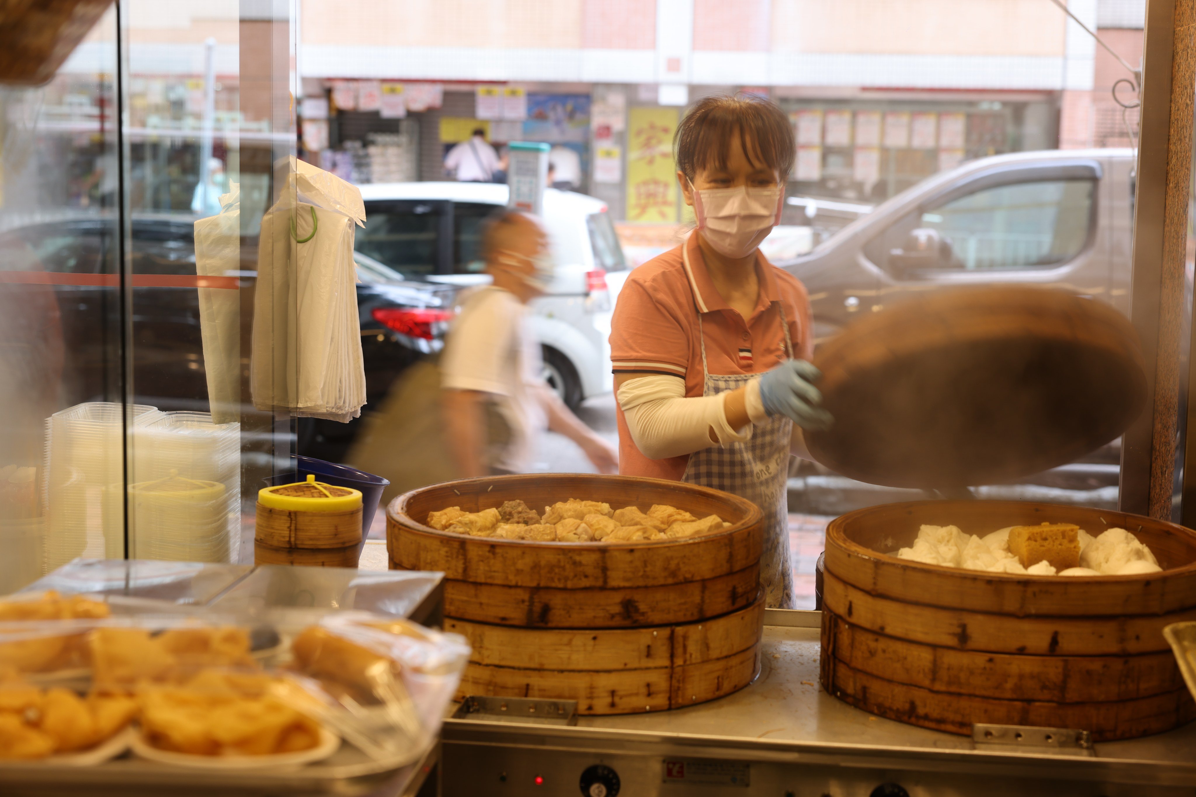 A staff member at an eatery in Tsuen Wan. Simon Wong, chairman and CEO of catering group LH Group, said Hong Kong’s ageing population had increased the need for importing workers. Photo: Nora Tam