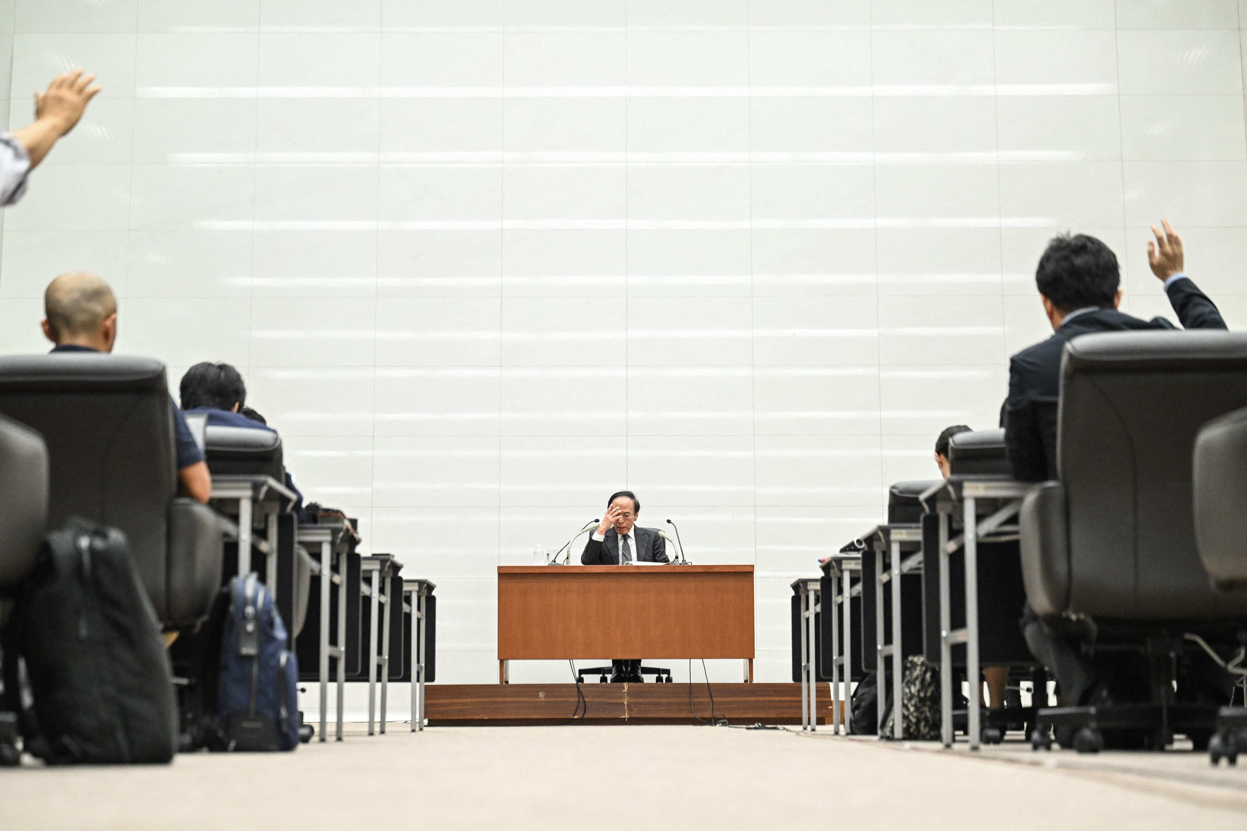 Bank of Japan governor Kazuo Ueda attends a press conference in Tokyo. The central bank kept its ultra-low interest rates unchanged on June 14, pushing the yen to a fresh 34-year low against the US dollar. Photo: AFP