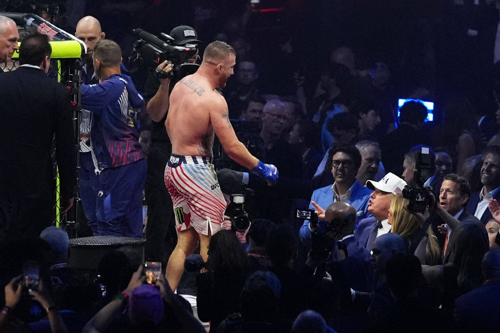 US President Donald Trump (in white hat) congratulates Justin Gaethje after his win over Ilia Topuria in a lightweight title bout during UFC Freedom 250 on Sunday. Photo: AFP