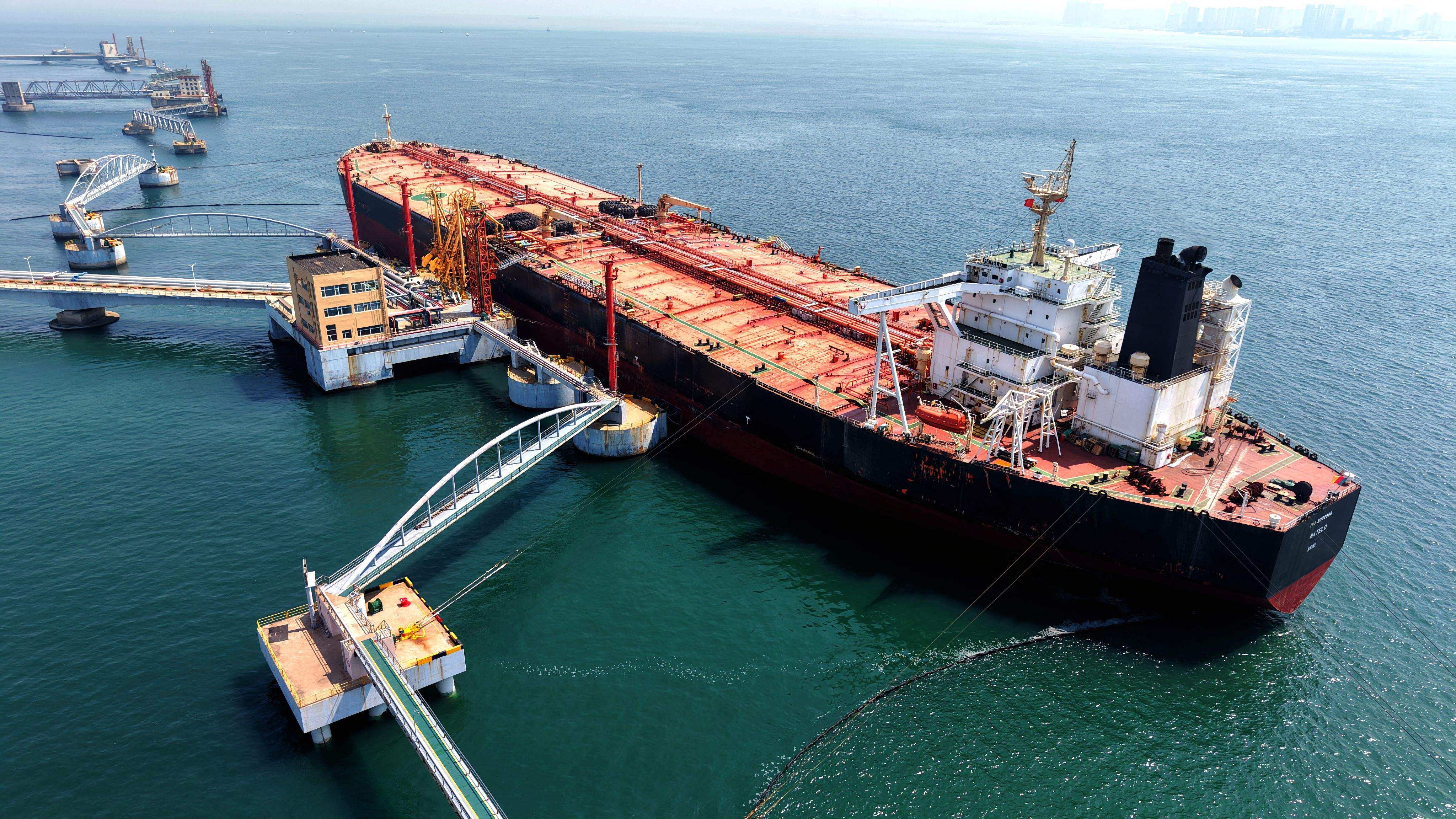 A tanker is seen unloading imported crude oil at a terminal port in China’s Shandong province on Tuesday. Photo: AFP