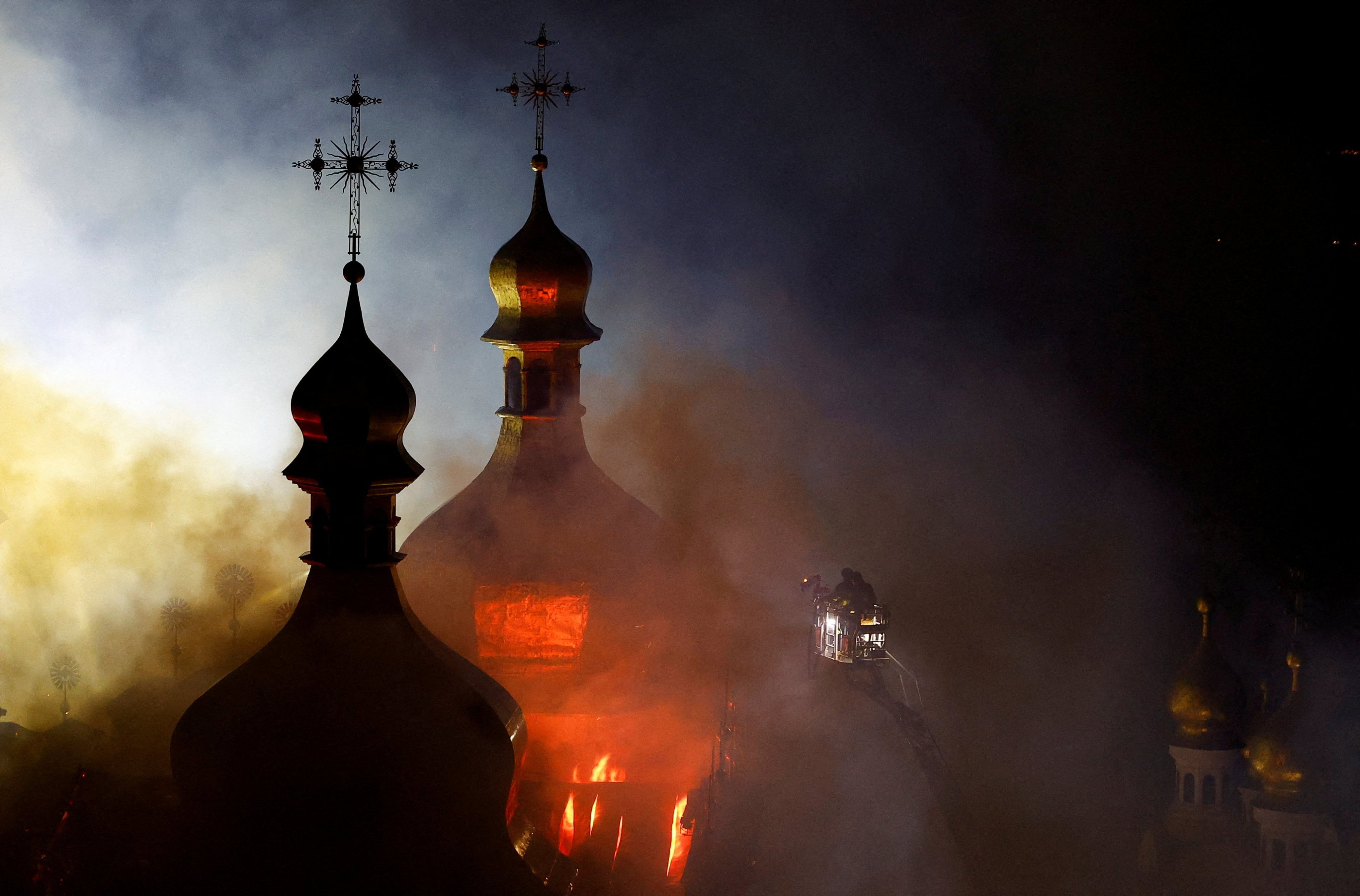 Smoke and fire rise from the Dormition Cathedral in the Orthodox complex of Kyiv-Pechersk Lavra following a Russian missile strike on Monday. Photo: Reuters