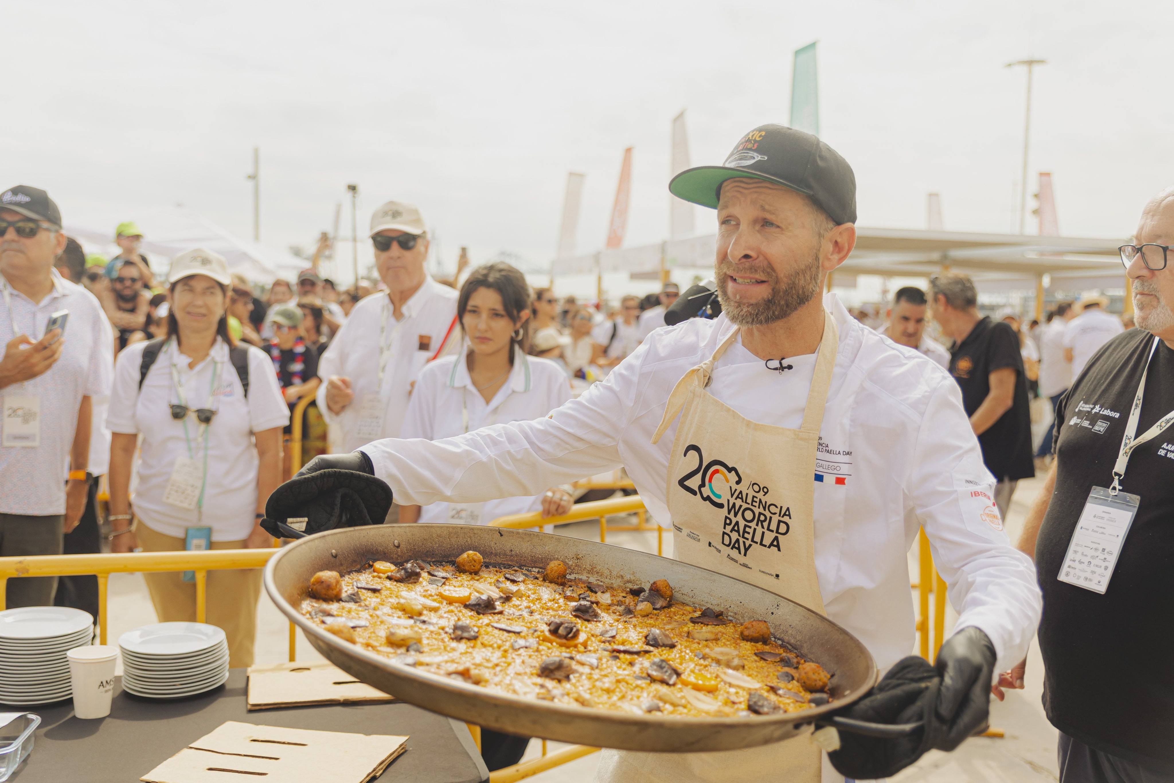 French chef Frederic Gallego holds his winning paella at the 2025 World Paella Day in Valencia. The Spanish city celebrates the rice dish in a big way, with its origins lying just a few kilometres south in the Albufera nature reserve. Photo: Santiago Vidal/Visit Valencia/dpa