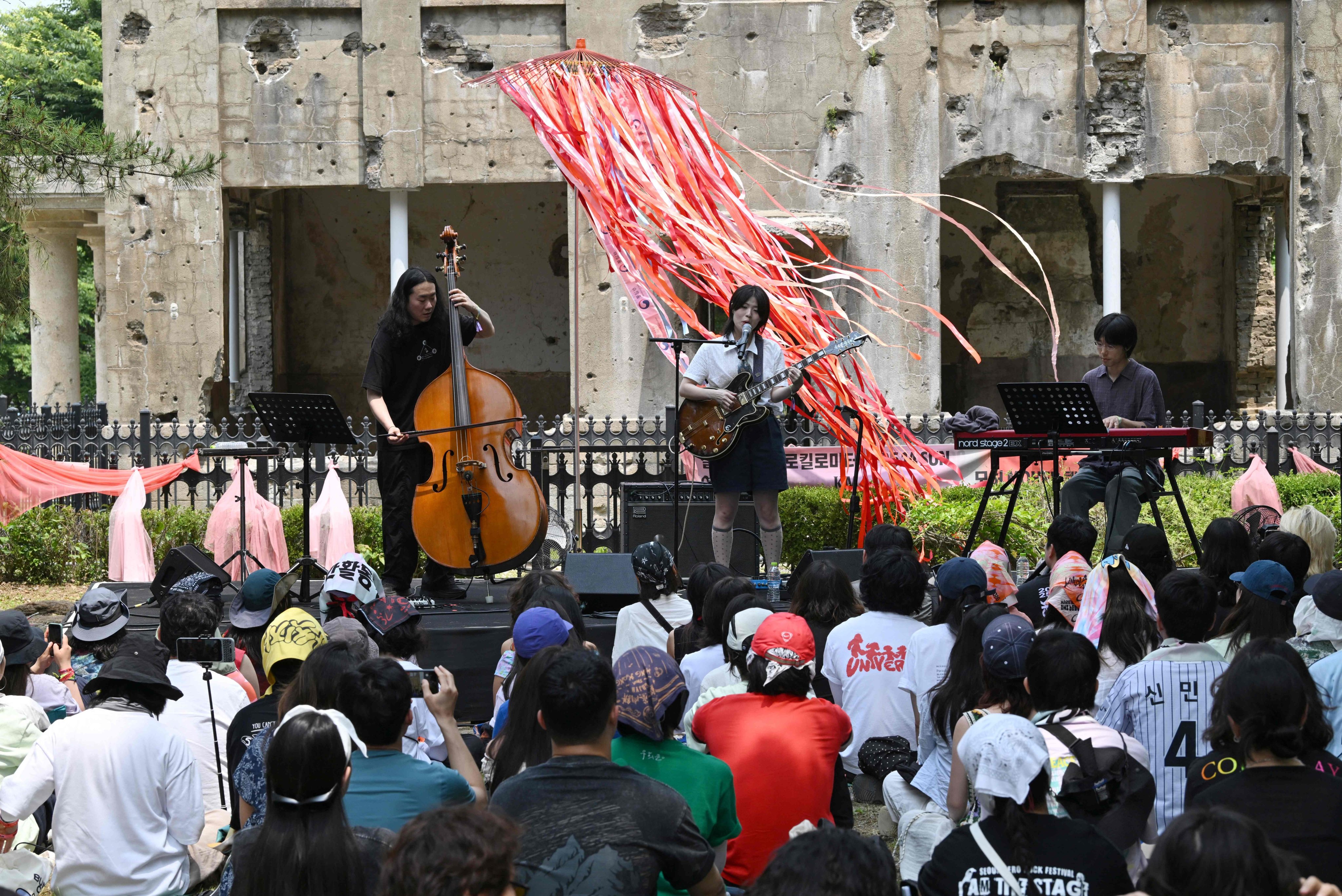 South Korean indie-pop musician Haepa performs in front of the former North Korean Workers Party Headquarters on the sidelines of the DMZ Peace Train Festival near the North Korean border on Sunday. Photo: AFP