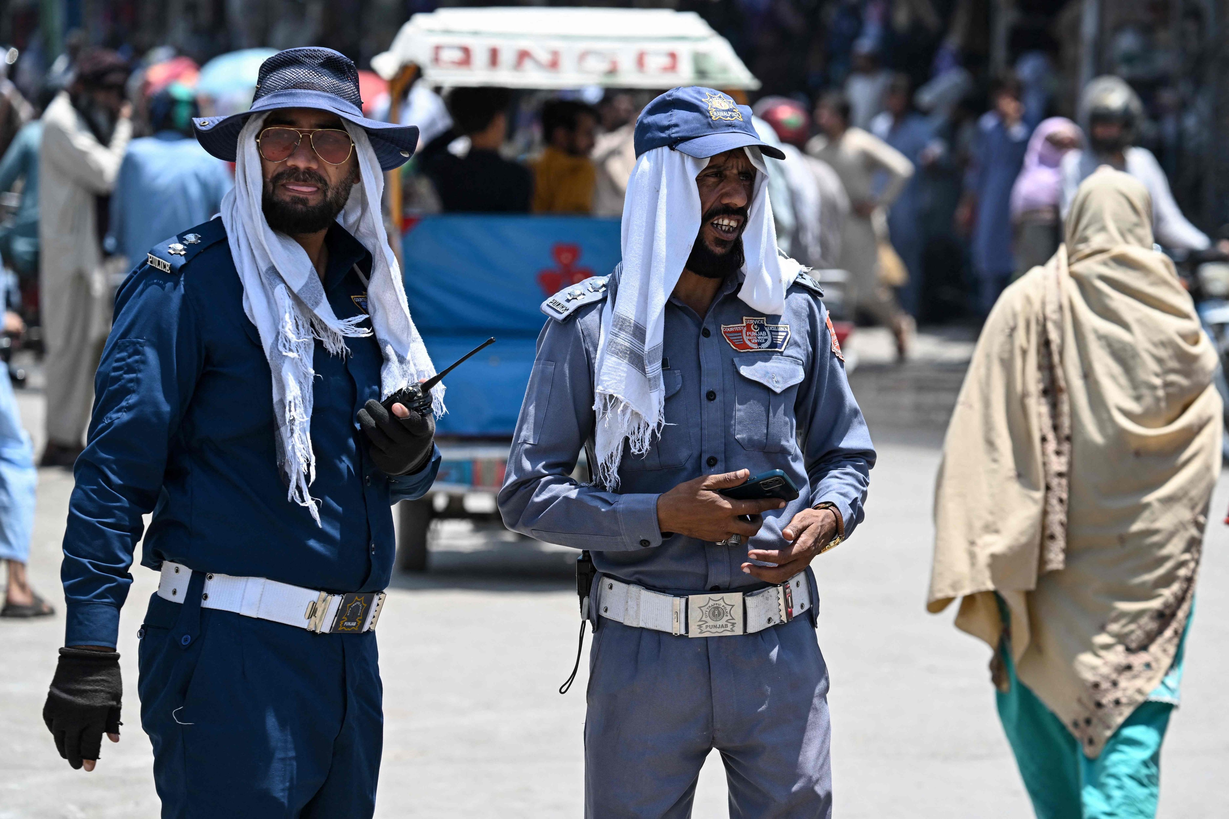 Police officers stand at a road junction in Rawalpindi, Pakistan, on Tuesday. Photo: AFP