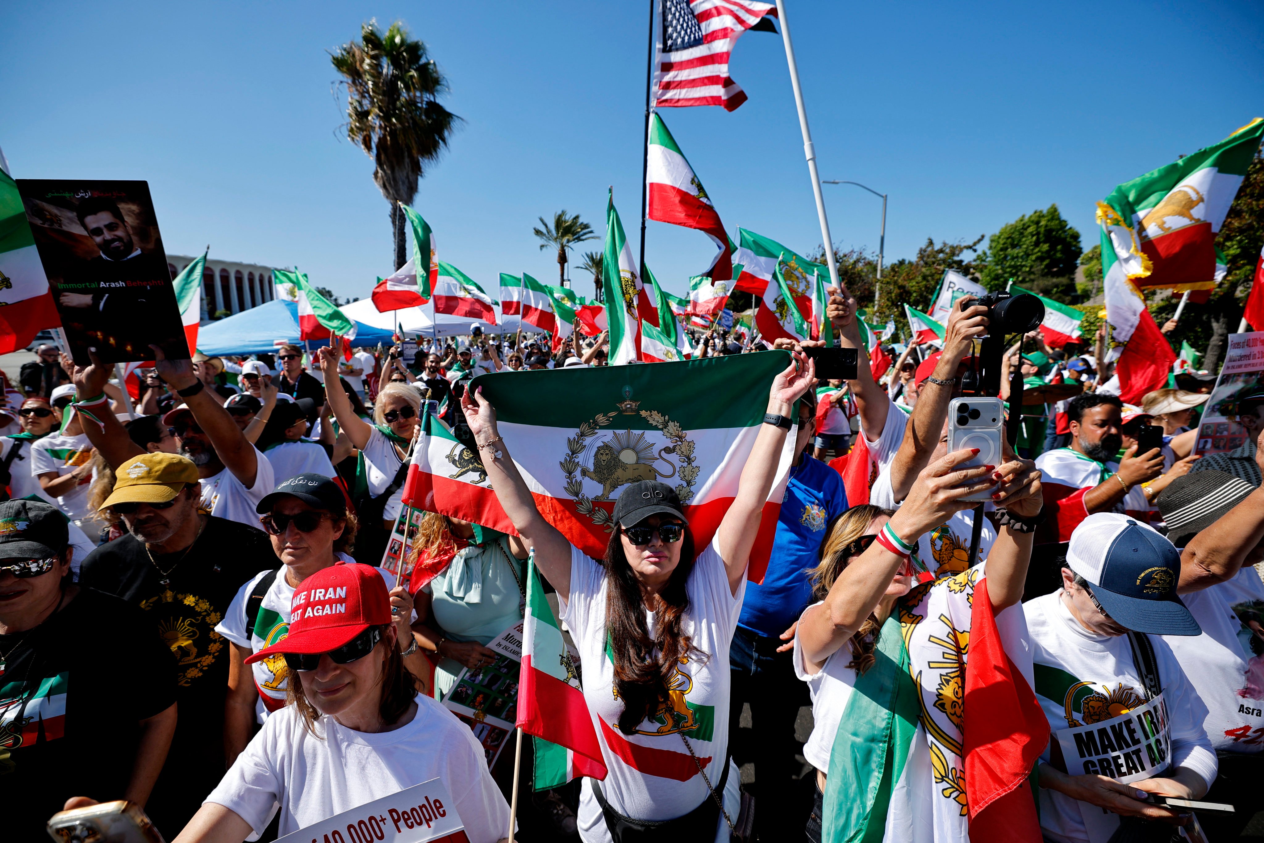 Football fans wave Iran and US flags during a protest outside Los Angeles Stadium (SoFi Stadium) ahead of the 2026 World Cup football match between Iran and New Zealand in Inglewood, California on Monday. Photo: Reuters